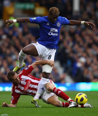 LIVERPOOL, ENGLAND - OCTOBER 30:  Louis Saha of Everton attempts to move past a challenge from Danny Collins of Stoke City during the Barclays Premier League match between Everton and Stoke City at Goodison Park on October 30, 2010 in Liverpool, England.