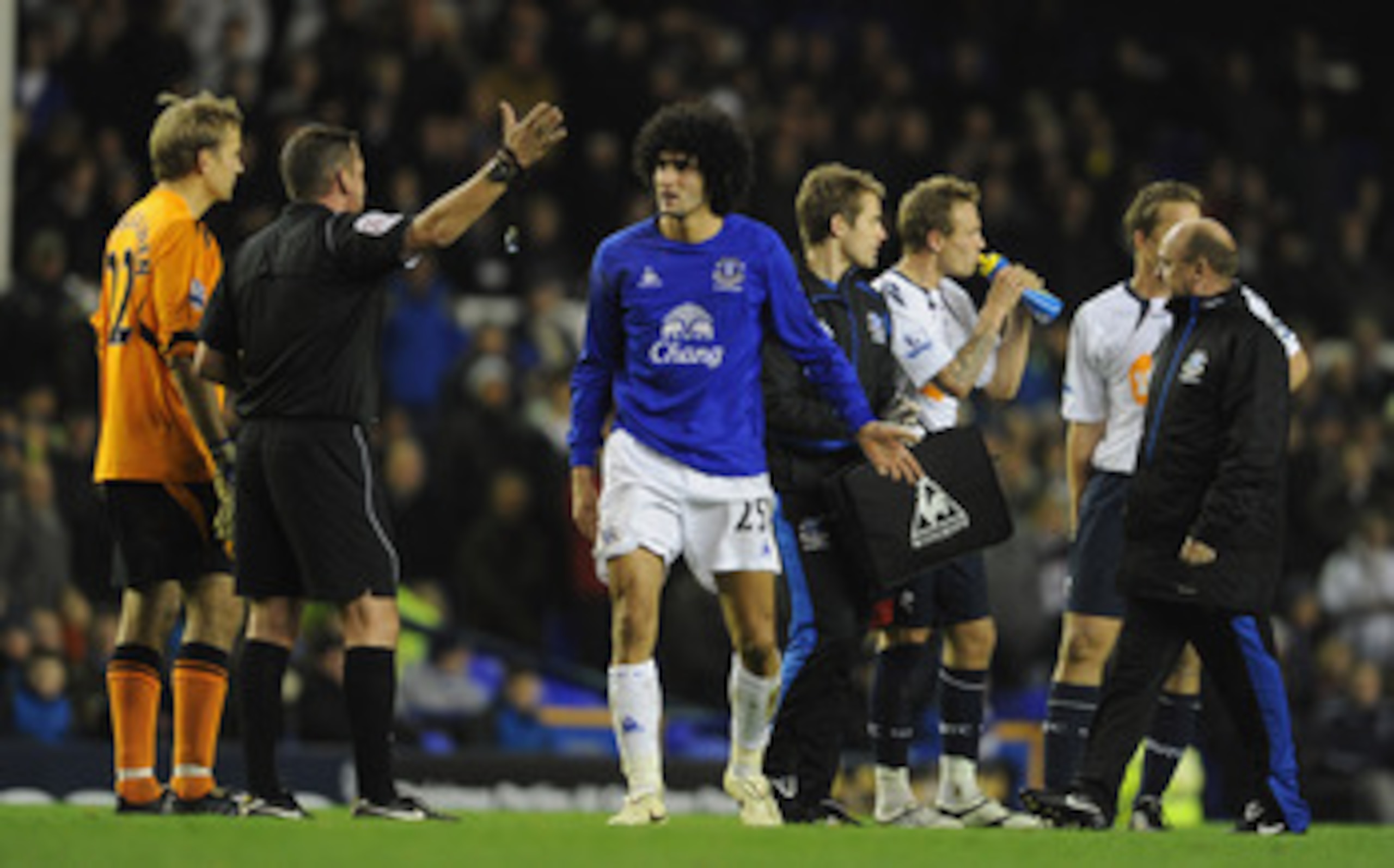 LIVERPOOL, ENGLAND - NOVEMBER 10:  Marouane Fellaini of Everton protests to referee Phil Dowd after being sent off during the Barclays Premier League match between Everton and Bolton Wanderers at Goodison Park on November 10, 2010 in Liverpool, England.