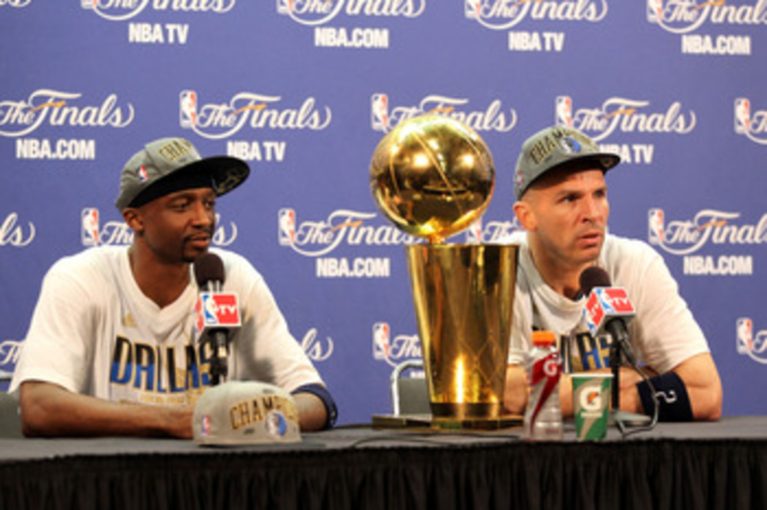 MIAMI, FL - JUNE 12:  Jason Terry #31 and Jason Kidd #2 of the Dallas Mavericks answer questions from the media as the Larry O'Brien Championship trophy sits on the table during a post game news conference after the Mavericks won 105-95 against the Miami