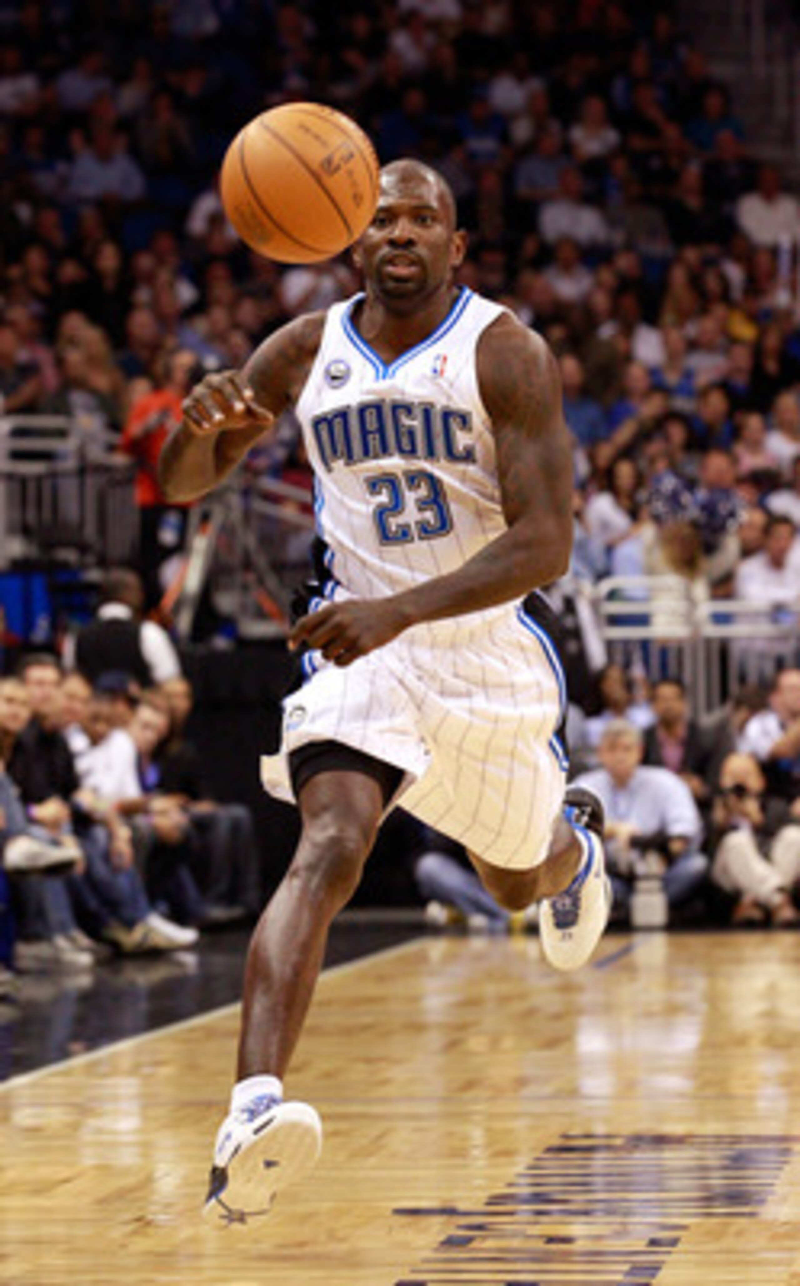 ORLANDO, FL - FEBRUARY 13: Jason Richardson #23 of the Orlando Magic chases a loose ball during the game against the Los Angeles Lakers at Amway Arena on February 13, 2011 in Orlando, Florida. NOTE TO USER: User expressly acknowledges and agrees that, b ORLANDO, FL - FEBRUARY 13: Jason Richardson #23 of the Orlando Magic chases a loose ball during the game against the Los Angeles Lakers at Amway Arena on February 13, 2011 in Orlando, Florida. NOTE TO USER: User expressly acknowledges and agrees that, b