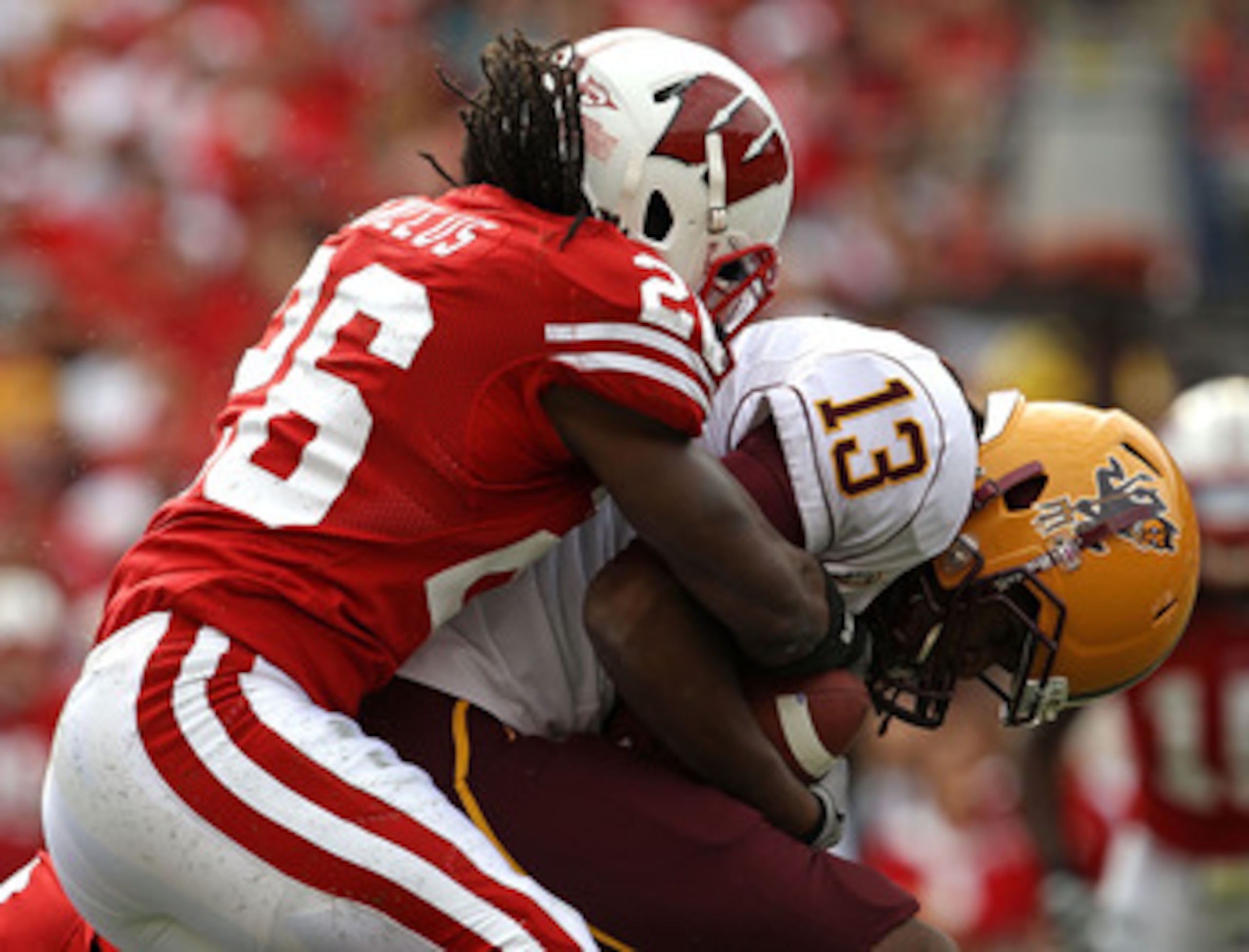 MADISON, WI - SEPTEMBER 18: George Bell #13 of the Arizona State Sun Devils is tackled by Antonio Fenelus #26 of the Wisconsin Badgers at Camp Randall Stadium on September 18, 2010 in Madison, Wisconsin. (Photo by Jonathan Daniel/Getty Images) MADISON, WI - SEPTEMBER 18: George Bell #13 of the Arizona State Sun Devils is tackled by Antonio Fenelus #26 of the Wisconsin Badgers at Camp Randall Stadium on September 18, 2010 in Madison, Wisconsin. (Photo by Jonathan Daniel/Getty Images)