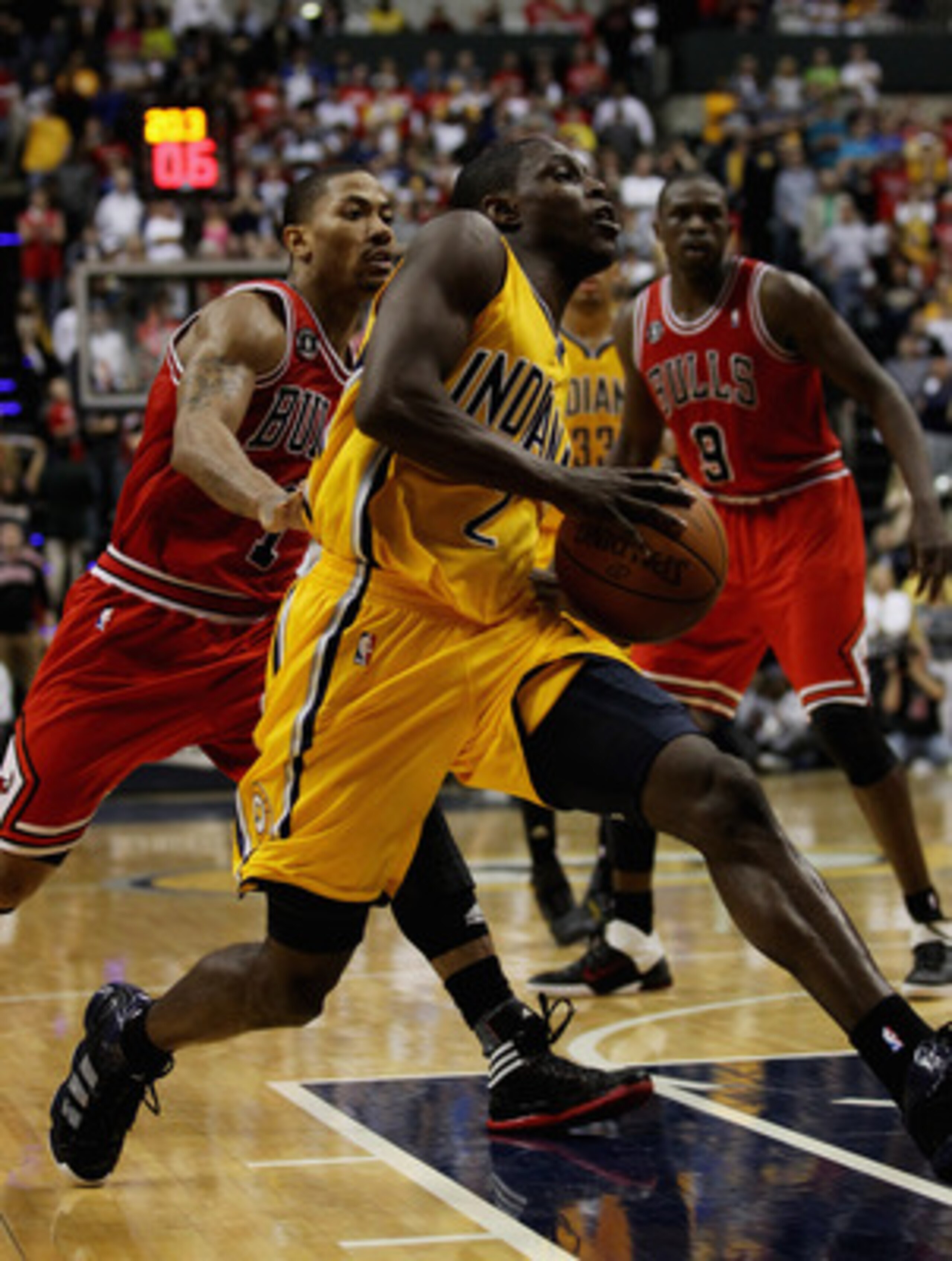 INDIANAPOLIS, IN - APRIL 23: Darren Collison #2 of the Indiana Pacers drives past Derrick Rose #1 of the Chicago Bulls in Game Four of the Eastern Conference Quarterfinals in the 2011 NBA Playoffs at Conseco Fieldhouse on April 23, 2011 in Indianapolis, I
