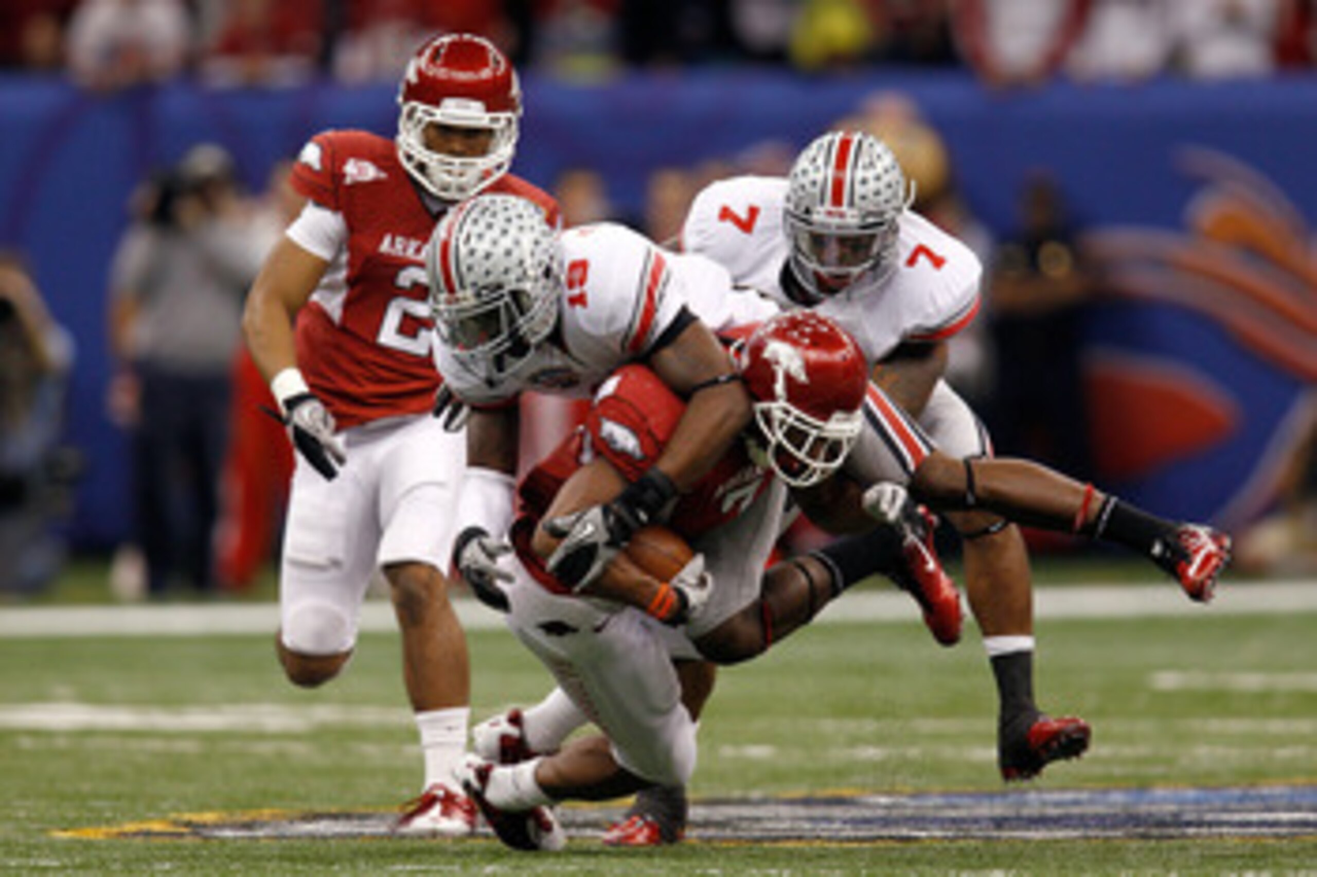 NEW ORLEANS, LA - JANUARY 04: Knile Davis #7 of the Arkansas Razorbacks runs the ball as Orhian Johnson #19 of the Ohio State Buckeyes attempts to tackle him in the second quarter during the Allstate Sugar Bowl at the Louisiana Superdome on January 4, 20 NEW ORLEANS, LA - JANUARY 04: Knile Davis #7 of the Arkansas Razorbacks runs the ball as Orhian Johnson #19 of the Ohio State Buckeyes attempts to tackle him in the second quarter during the Allstate Sugar Bowl at the Louisiana Superdome on January 4, 20