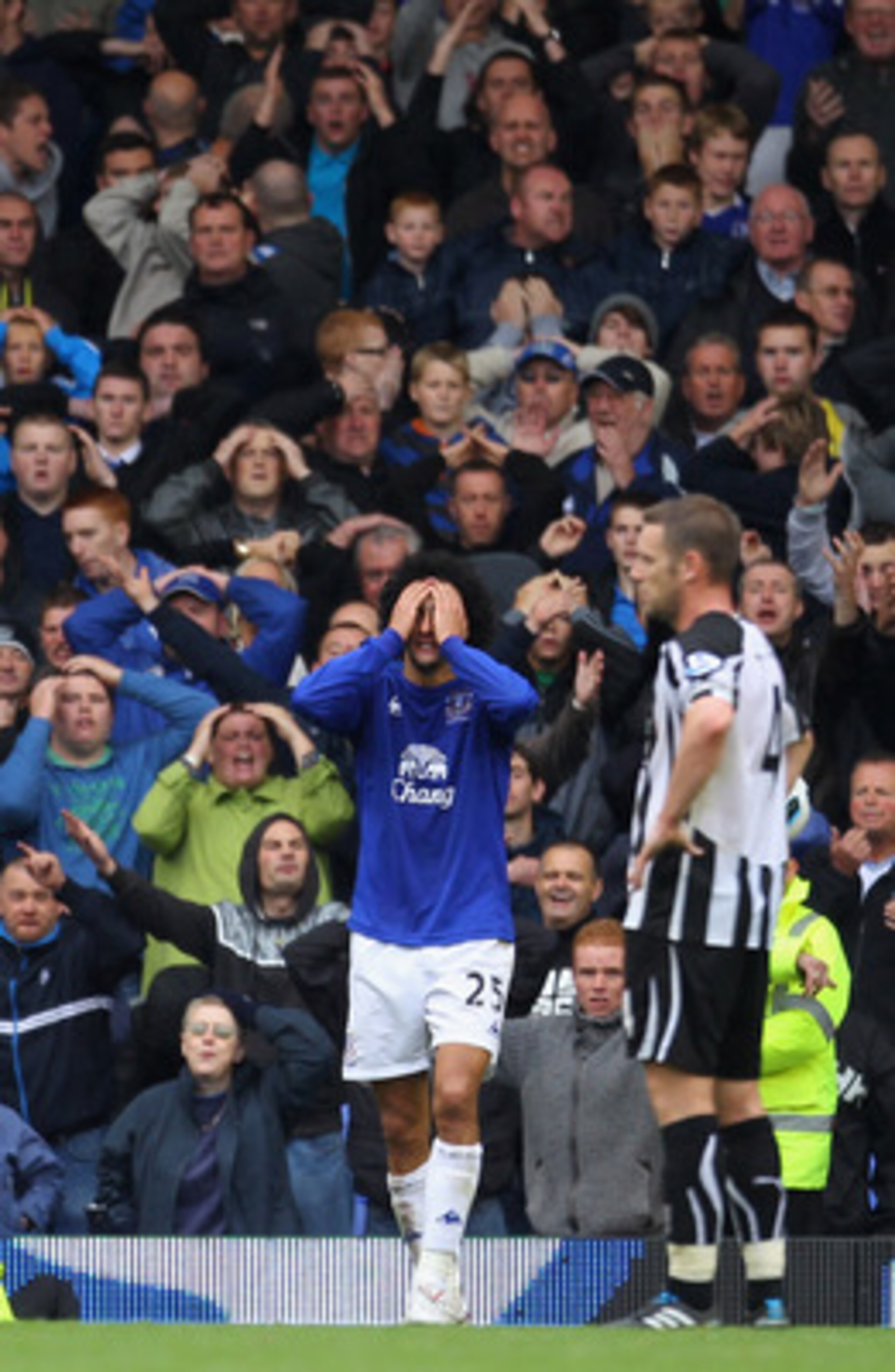LIVERPOOL, ENGLAND - SEPTEMBER 18:  Marouane Fellaini of Everton holds his head after missing a goalscoring chance during the Barclays Premier League match between Everton and Newcastle United at Goodison Park on September 18, 2010 in Liverpool, England.