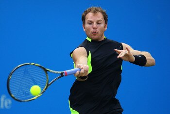 LONDON, ENGLAND - JUNE 08:  Michael Russell of the United States hits a return shot during his Men's Singles second round match against Janko Tipsarevic of Serbia on day three of the AEGON Championships at Queens Club on June 8, 2011 in London, England.