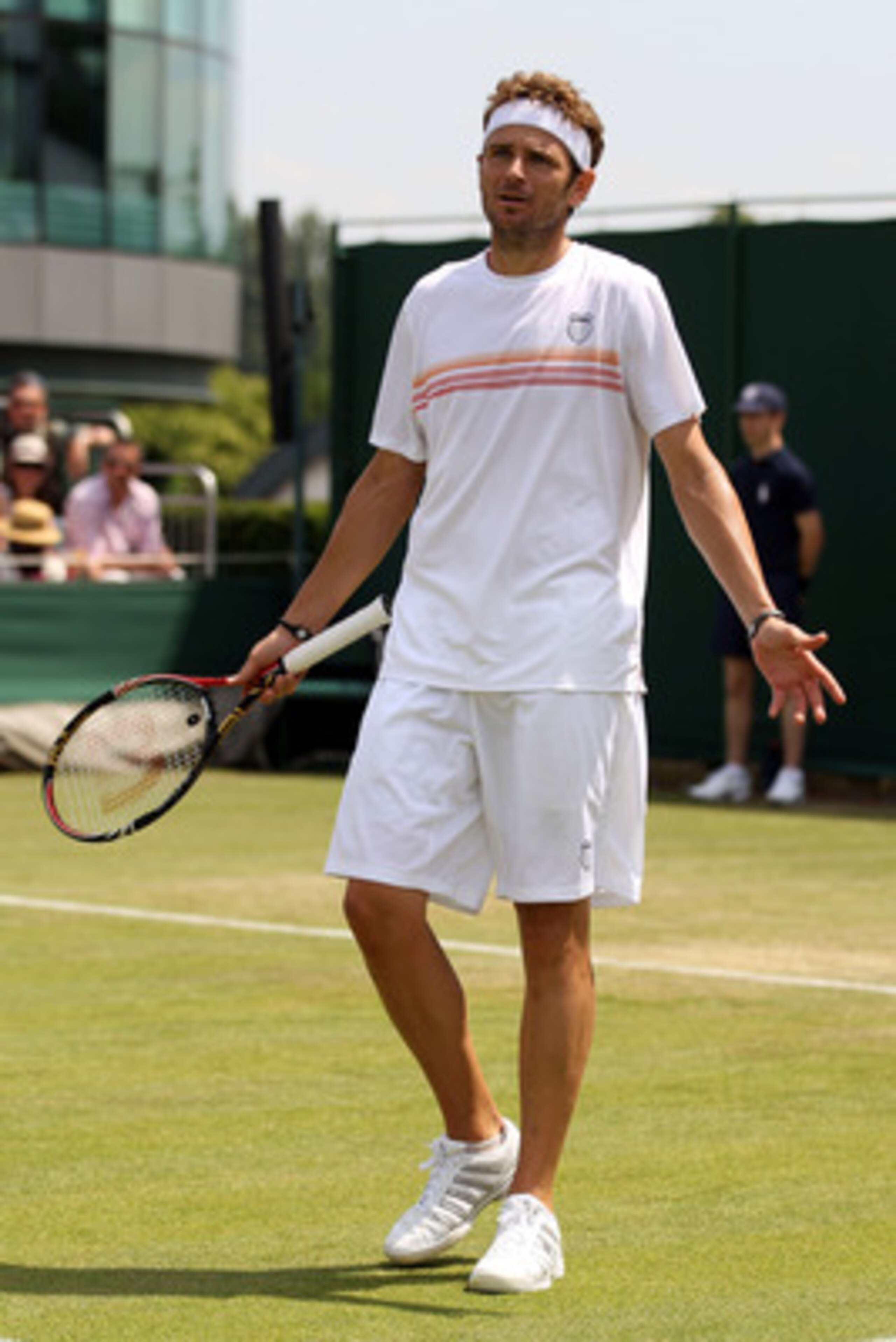 LONDON, ENGLAND - JUNE 23:  Mardy Fish of USA plays a shot during his second round match against Florian Mayer of Germany on Day Three of the Wimbledon Lawn Tennis Championships at the All England Lawn Tennis and Croquet Club on June 23, 2010 in London, E