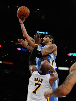 LOS ANGELES, CA - APRIL 03:  Kenyon Martin #4 of the Denver Nuggets scores a basket against Lamar Odom #7 of the Los Angeles Lakers during the second quarter of the NBS basketball game at Staples Center on April 3, 2011 in Los Angeles, California. NOTE TO
