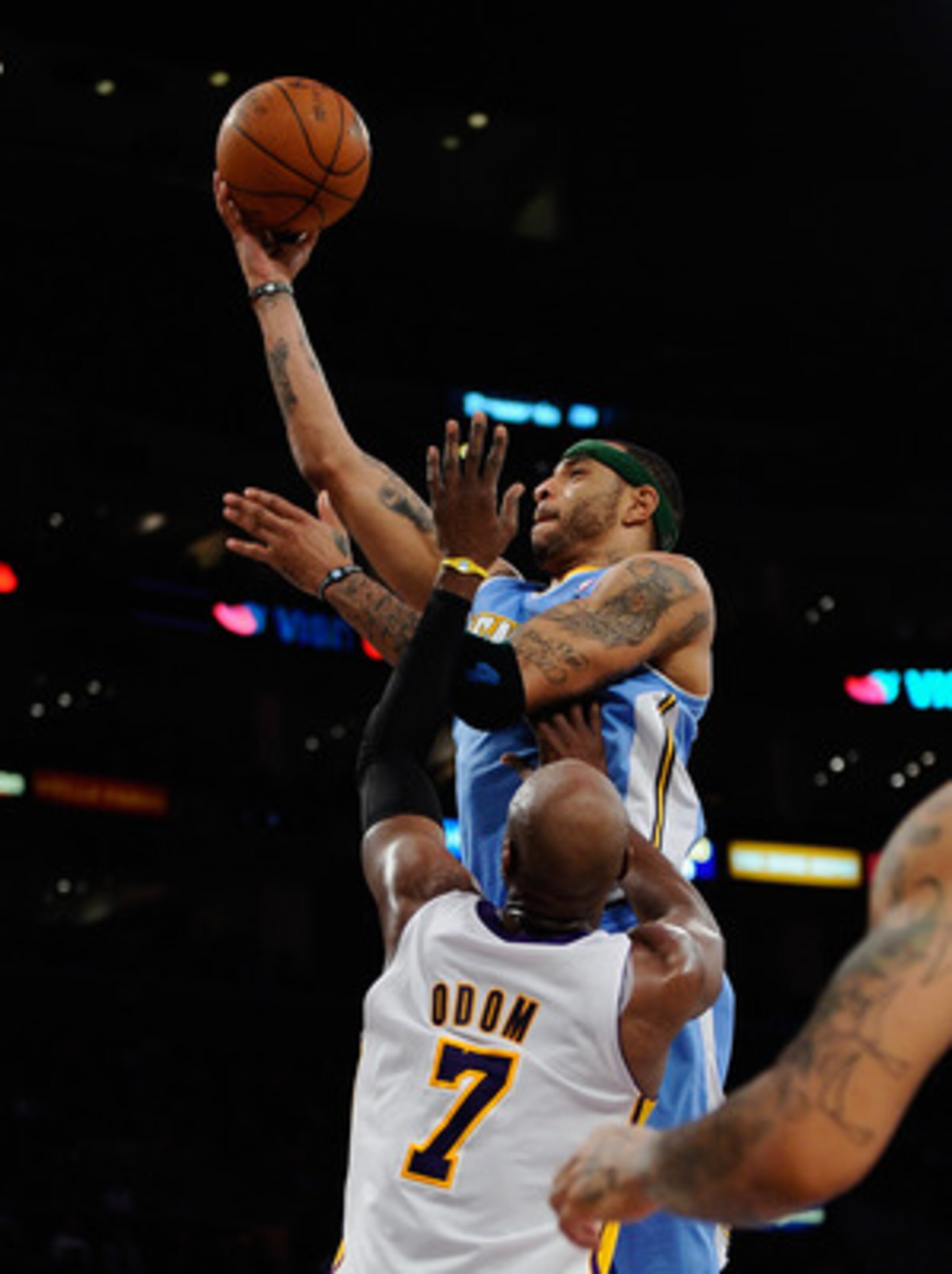 LOS ANGELES, CA - APRIL 03: Kenyon Martin #4 of the Denver Nuggets scores a basket against Lamar Odom #7 of the Los Angeles Lakers during the second quarter of the NBS basketball game at Staples Center on April 3, 2011 in Los Angeles, California. NOTE TO LOS ANGELES, CA - APRIL 03: Kenyon Martin #4 of the Denver Nuggets scores a basket against Lamar Odom #7 of the Los Angeles Lakers during the second quarter of the NBS basketball game at Staples Center on April 3, 2011 in Los Angeles, California. NOTE TO
