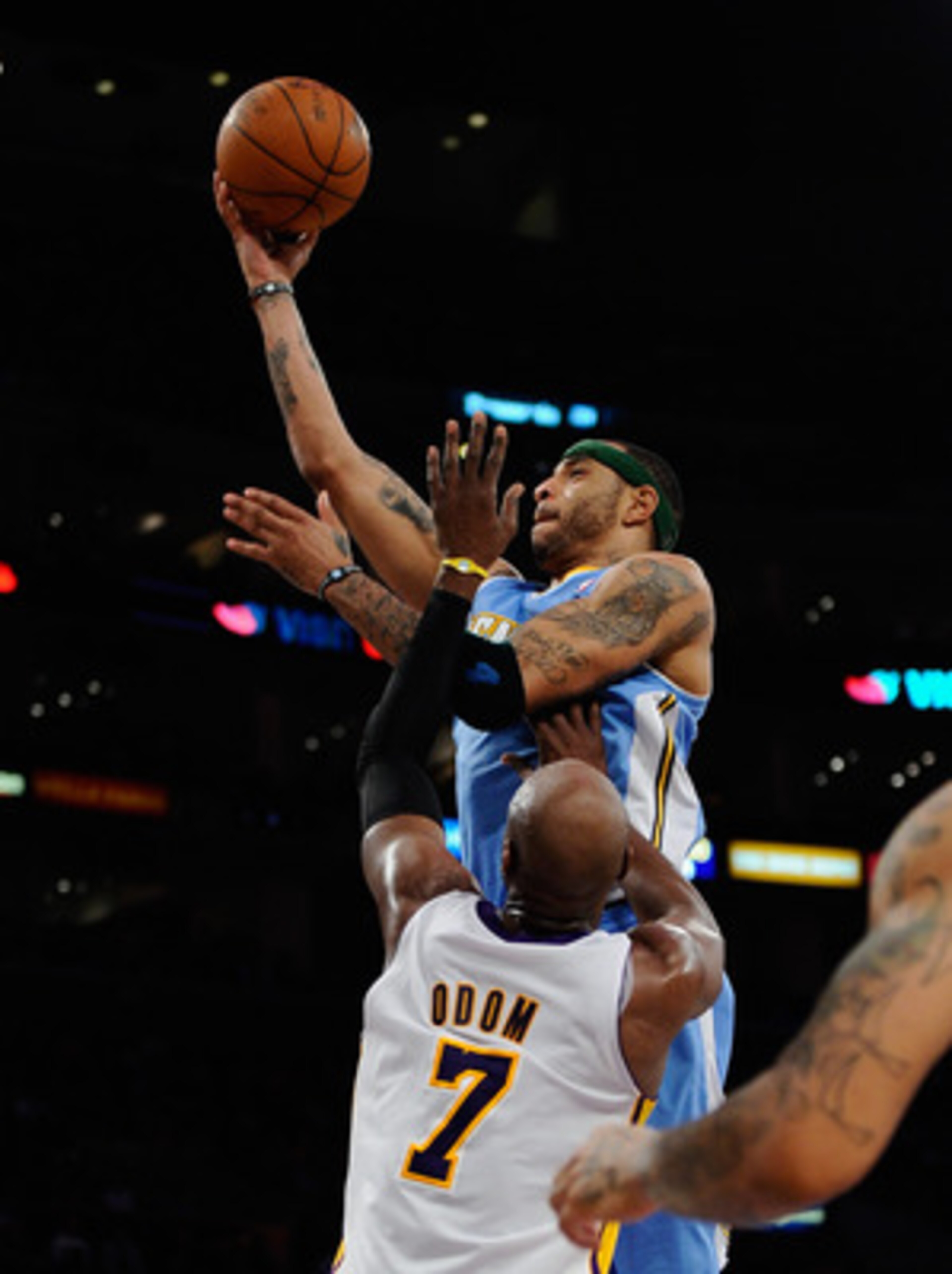 LOS ANGELES, CA - APRIL 03: Kenyon Martin #4 of the Denver Nuggets scores a basket against Lamar Odom #7 of the Los Angeles Lakers during the second quarter of the NBS basketball game at Staples Center on April 3, 2011 in Los Angeles, California. NOTE TO LOS ANGELES, CA - APRIL 03: Kenyon Martin #4 of the Denver Nuggets scores a basket against Lamar Odom #7 of the Los Angeles Lakers during the second quarter of the NBS basketball game at Staples Center on April 3, 2011 in Los Angeles, California. NOTE TO
