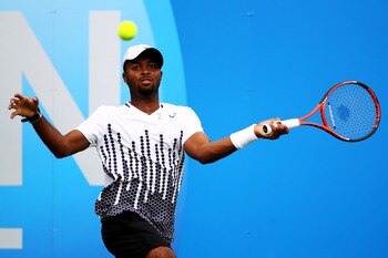 LONDON, ENGLAND - JUNE 08:  Donald Young of the United States returns a shot during his Men's Singles second round match against Kevin Anderson of South Africa on day three of the AEGON Championships at Queens Club on June 8, 2011 in London, England.  (Ph
