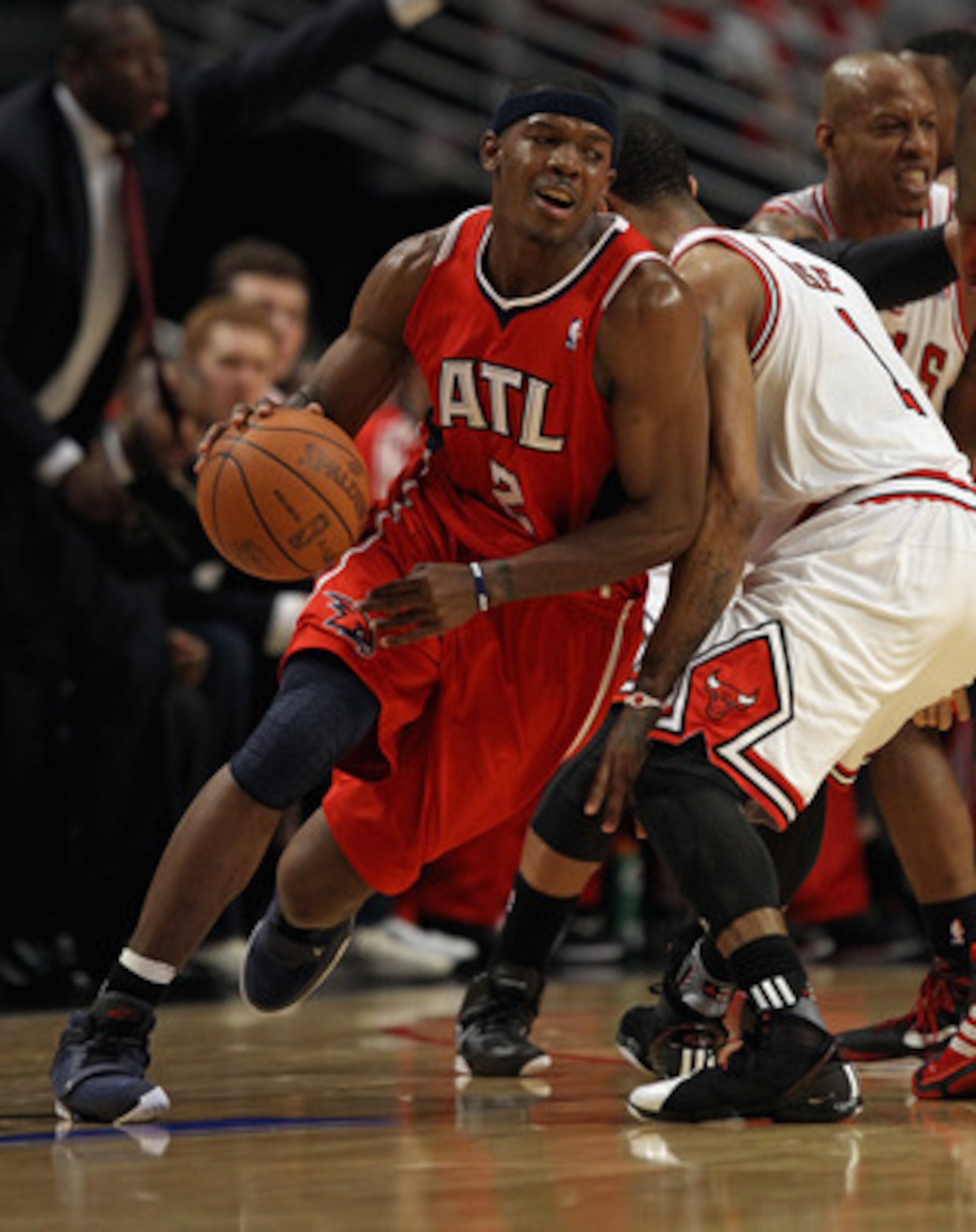 CHICAGO, IL - MAY 10: Joe Johnson #2 of the Atlanta Hawks moves around Derrick Rose #1 of the Chicago Bulls in Game Five of the Eastern Conference Semifinals in the 2011 NBA Playoffs at the United Center on May 10, 2011 in Chicago, Illinois. The Bulls def CHICAGO, IL - MAY 10: Joe Johnson #2 of the Atlanta Hawks moves around Derrick Rose #1 of the Chicago Bulls in Game Five of the Eastern Conference Semifinals in the 2011 NBA Playoffs at the United Center on May 10, 2011 in Chicago, Illinois. The Bulls def