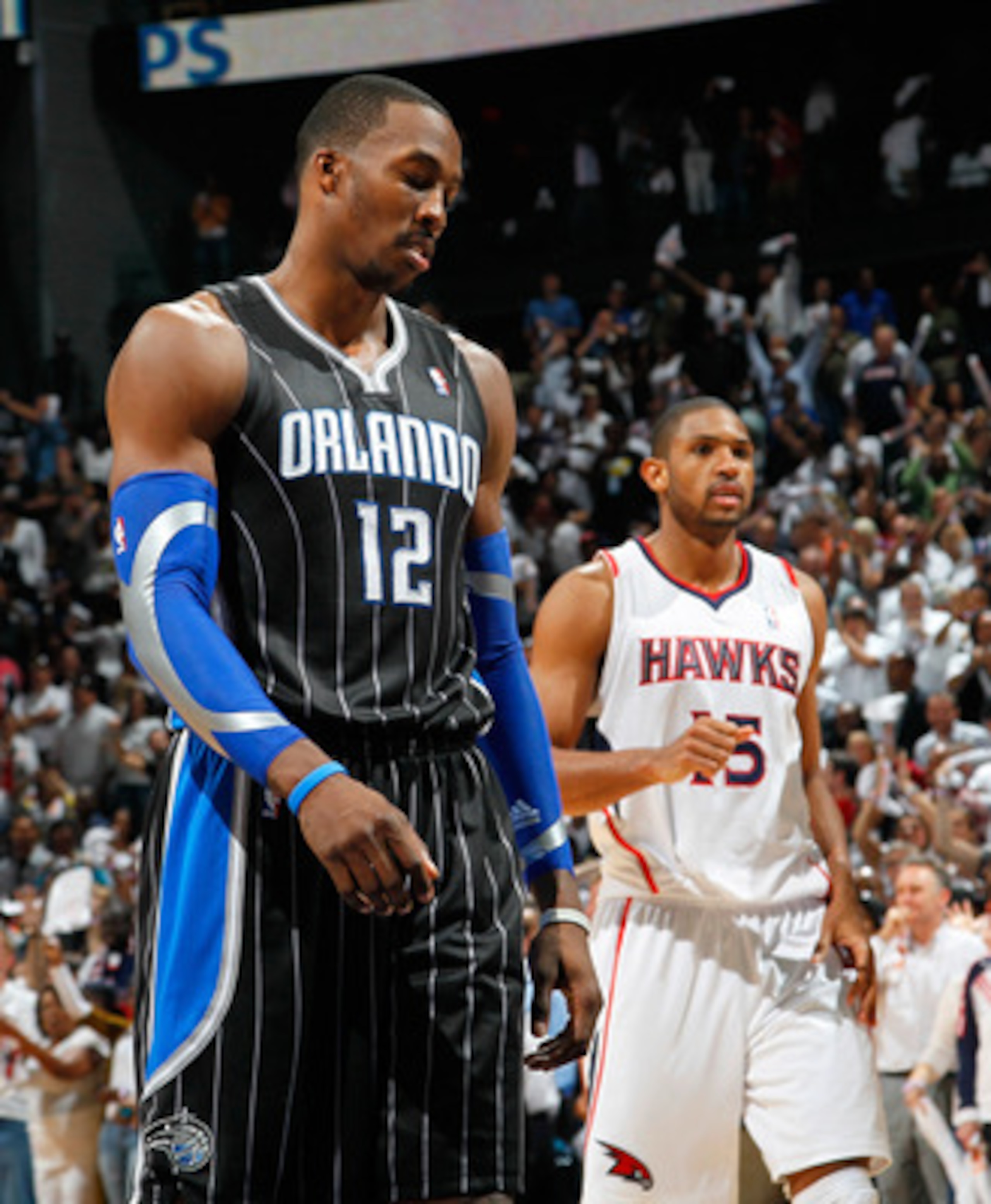 ATLANTA, GA - APRIL 28: Dwight Howard #12 of the Orlando Magic reacts after a turnover to the Atlanta Hawks during Game Six of the Eastern Conference Quarterfinals in the 2011 NBA Playoffs at Philips Arena on April 28, 2011 in Atlanta, Georgia. NOTE TO ATLANTA, GA - APRIL 28: Dwight Howard #12 of the Orlando Magic reacts after a turnover to the Atlanta Hawks during Game Six of the Eastern Conference Quarterfinals in the 2011 NBA Playoffs at Philips Arena on April 28, 2011 in Atlanta, Georgia. NOTE TO
