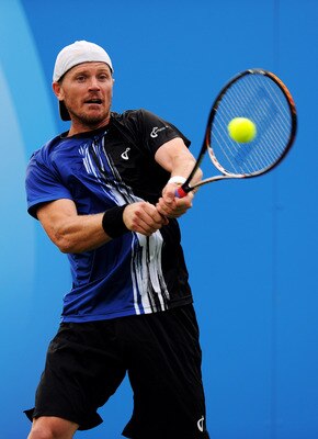 LONDON, ENGLAND - JUNE 06:  Alex Bogomolov, Jr. of the United States returns the ball during his Men's Singles first round match against Igor Kunitsyn of Russia on day one of the AEGON Championships at Queens Club on June 6, 2011 in London, England.  (Pho