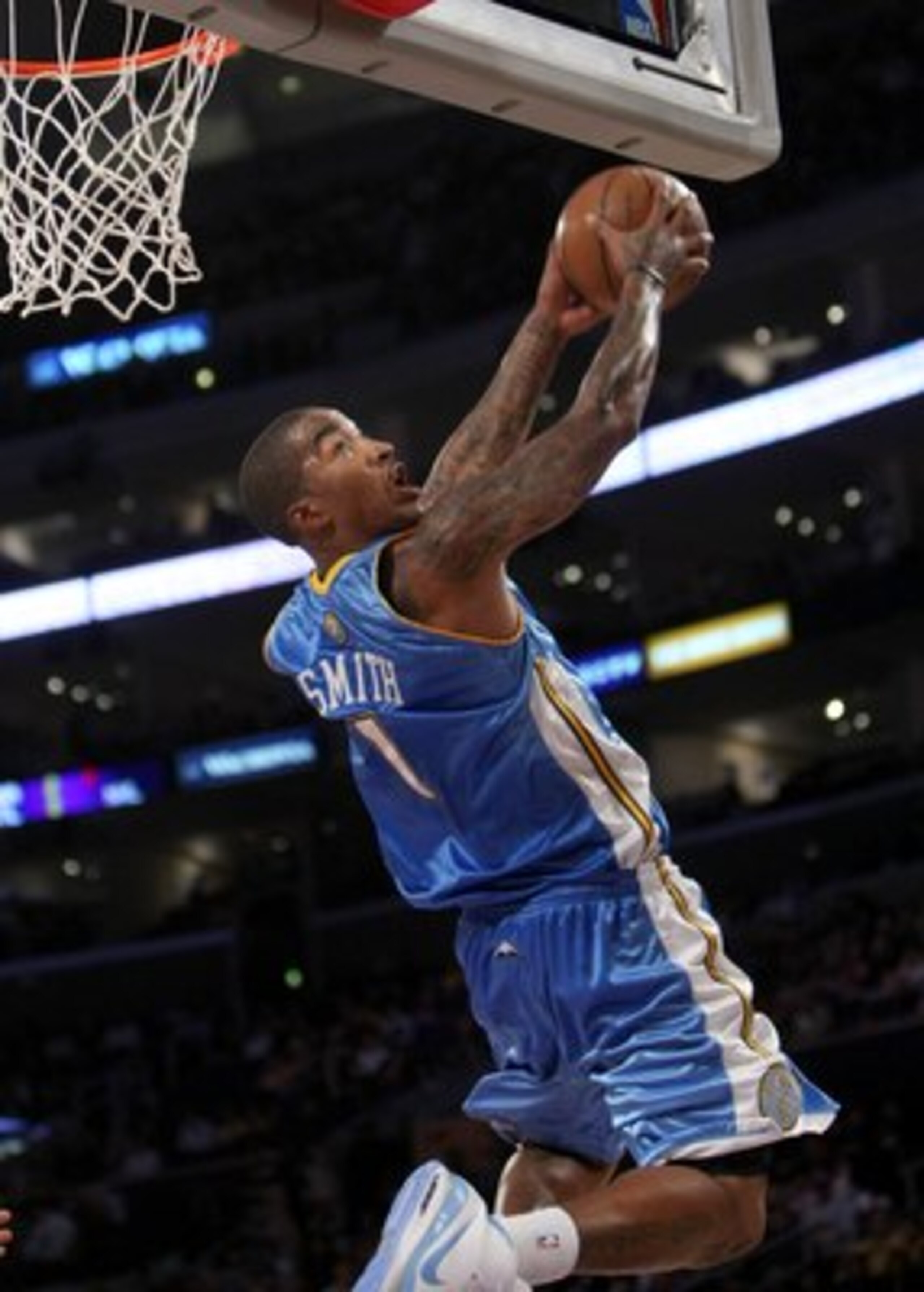 LOS ANGELES, CA - NOVEMBER 21:   J.R. Smith #1 of the Denver Nuggets makes a reverse dunk in the final seconds of the game with the Los Angeles Lakers on November 21, 2008 at Staples Center in Los Angeles, California.   The Lakers won 104-90.    NOTE TO U