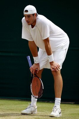 LONDON, ENGLAND - JUNE 25:  John Isner of USA rests during his match against Thiemo De Bakker of Netherlands on Day Five of the Wimbledon Lawn Tennis Championships at the All England Lawn Tennis and Croquet Club on June 25, 2010 in London, England.  (Phot