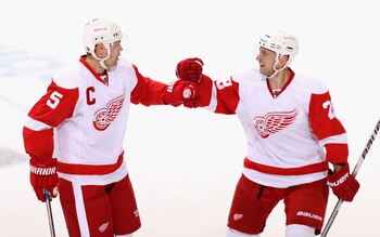 GLENDALE, AZ - APRIL 14:  Nicklas Lidstrom #5 and Brian Rafalski #28 of the Detroit Red Wings celebrate after Nicklas Lidstrom scored a first period power play goal against the Phoenix Coyotes in Game One of the Western Conference Quarterfinals during the