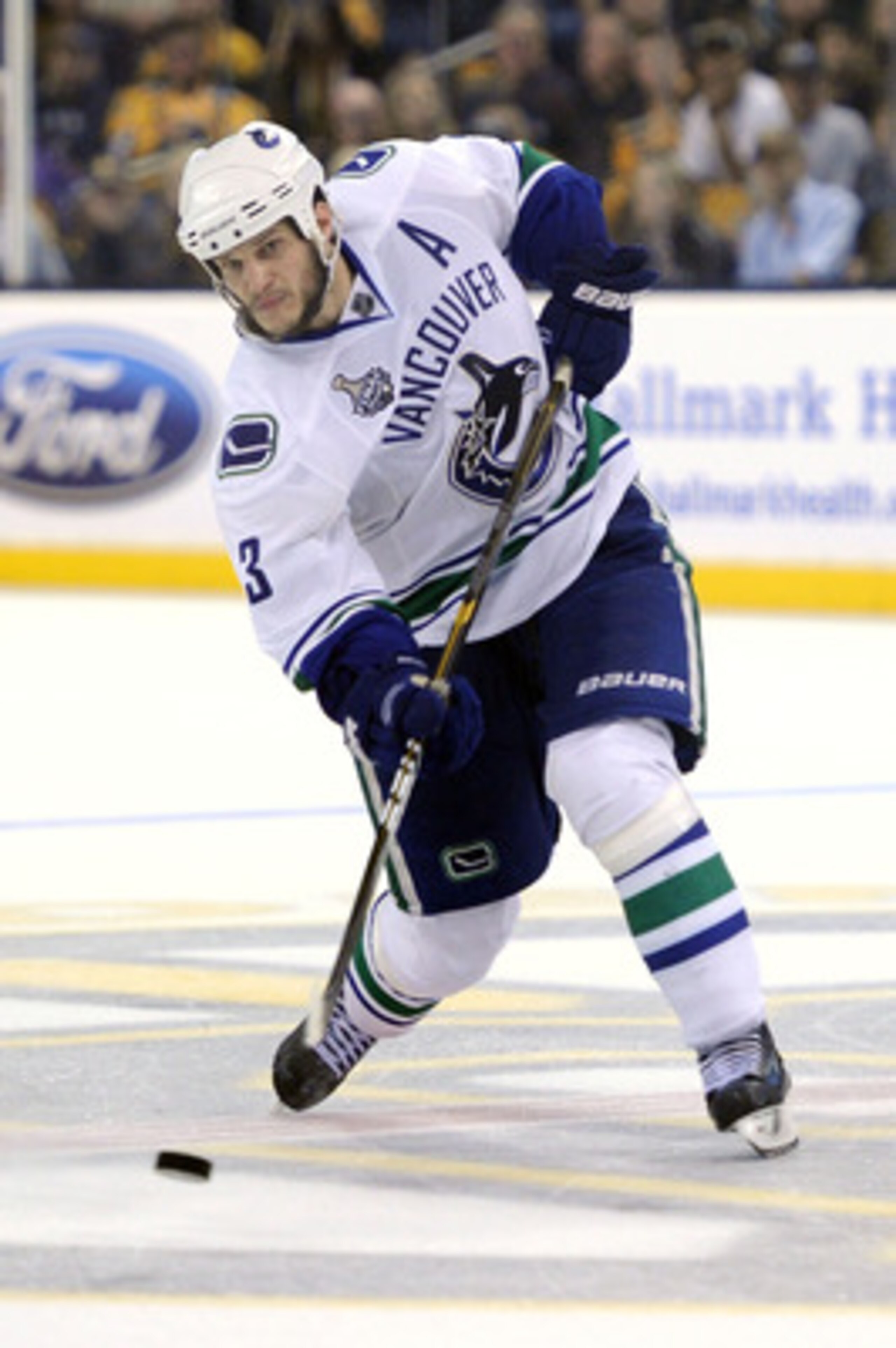 BOSTON, MA - JUNE 13: Kevin Bieksa #3 of the Vancouver Canucks takes a shot against the Boston Bruins during Game Six of the 2011 NHL Stanley Cup Final at TD Garden on June 13, 2011 in Boston, Massachusetts. (Photo by Harry How/Getty Images) BOSTON, MA - JUNE 13: Kevin Bieksa #3 of the Vancouver Canucks takes a shot against the Boston Bruins during Game Six of the 2011 NHL Stanley Cup Final at TD Garden on June 13, 2011 in Boston, Massachusetts. (Photo by Harry How/Getty Images)