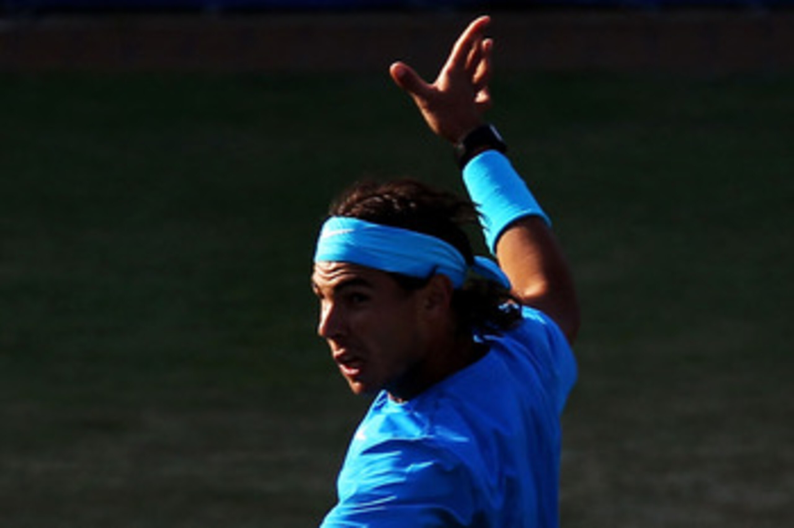 LONDON, ENGLAND - JUNE 10:  Rafael Nadal of Spain returns a shot during his Men's Singles quarter final match against Jo-Wilfred Tsonga of France on day five of the AEGON Championships at Queens Club on June 10, 2011 in London, England.  (Photo by Clive B