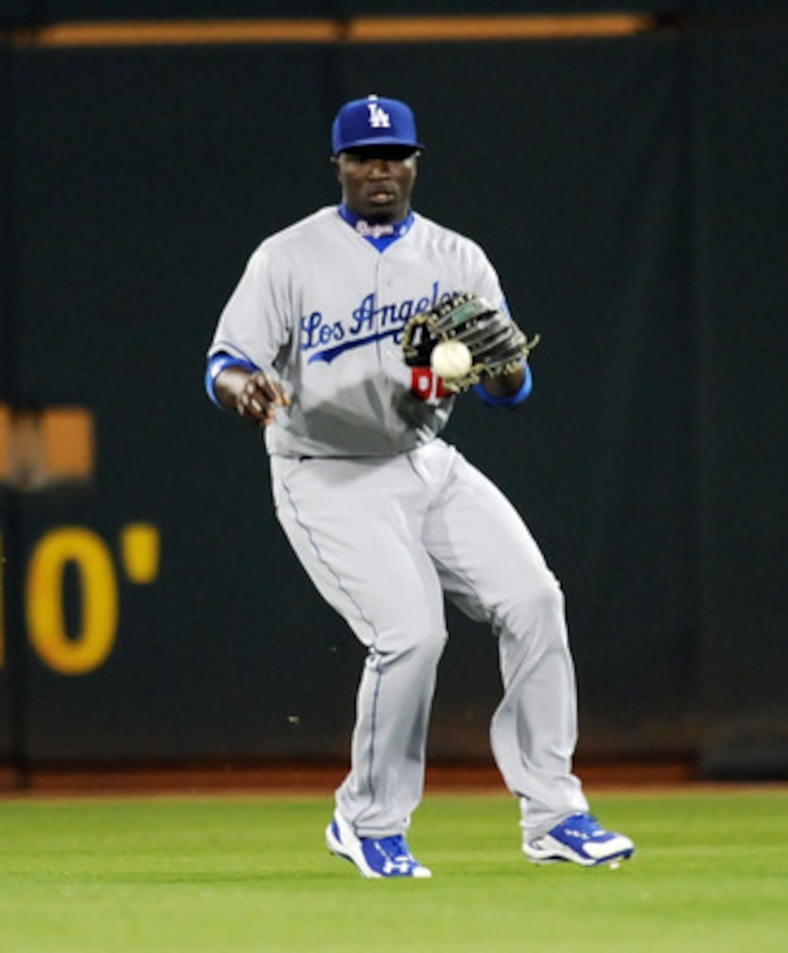 GOODYEAR, AZ - MARCH 03: Trayvon Robinson #62 of the Los Angeles Dodgers fields a base hit against the Cincinnati Reds at Goodyear Ballpark on March 3, 2011 in Goodyear, Arizona. (Photo by Norm Hall/Getty Images) GOODYEAR, AZ - MARCH 03: Trayvon Robinson #62 of the Los Angeles Dodgers fields a base hit against the Cincinnati Reds at Goodyear Ballpark on March 3, 2011 in Goodyear, Arizona. (Photo by Norm Hall/Getty Images)