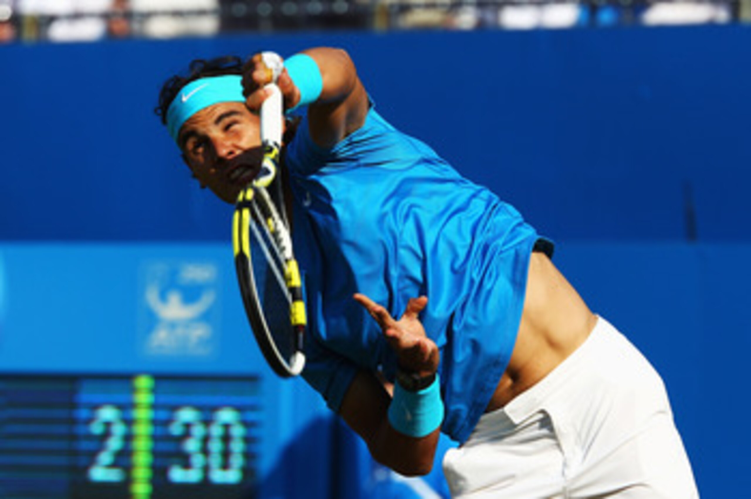 LONDON, ENGLAND - JUNE 10:  Rafael Nadal of Spain serves during his Men's Singles quarter final match against Jo-Wilfred Tsonga of France on day five of the AEGON Championships at Queens Club on June 10, 2011 in London, England.  (Photo by Clive Brunskill