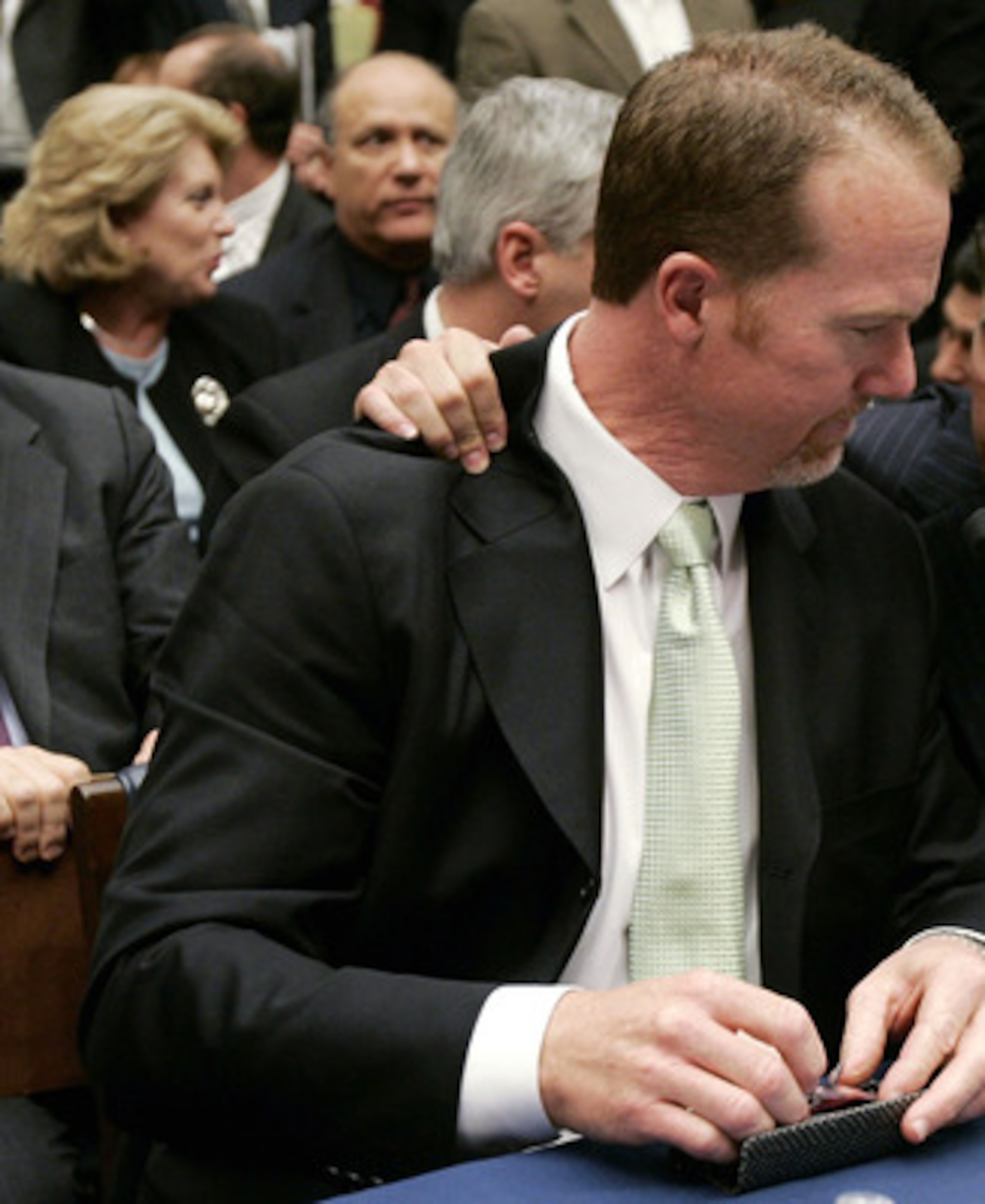 WASHINGTON - MARCH 17:  Former St. Louis Cardinal Mark McGwire (L) talks with Rafael Palmeiro of the Baltimore Orioles during a House Committe session investigating Major League Baseball's effort to eradicate steroid use on Capitol Hill March 17, 2005 in