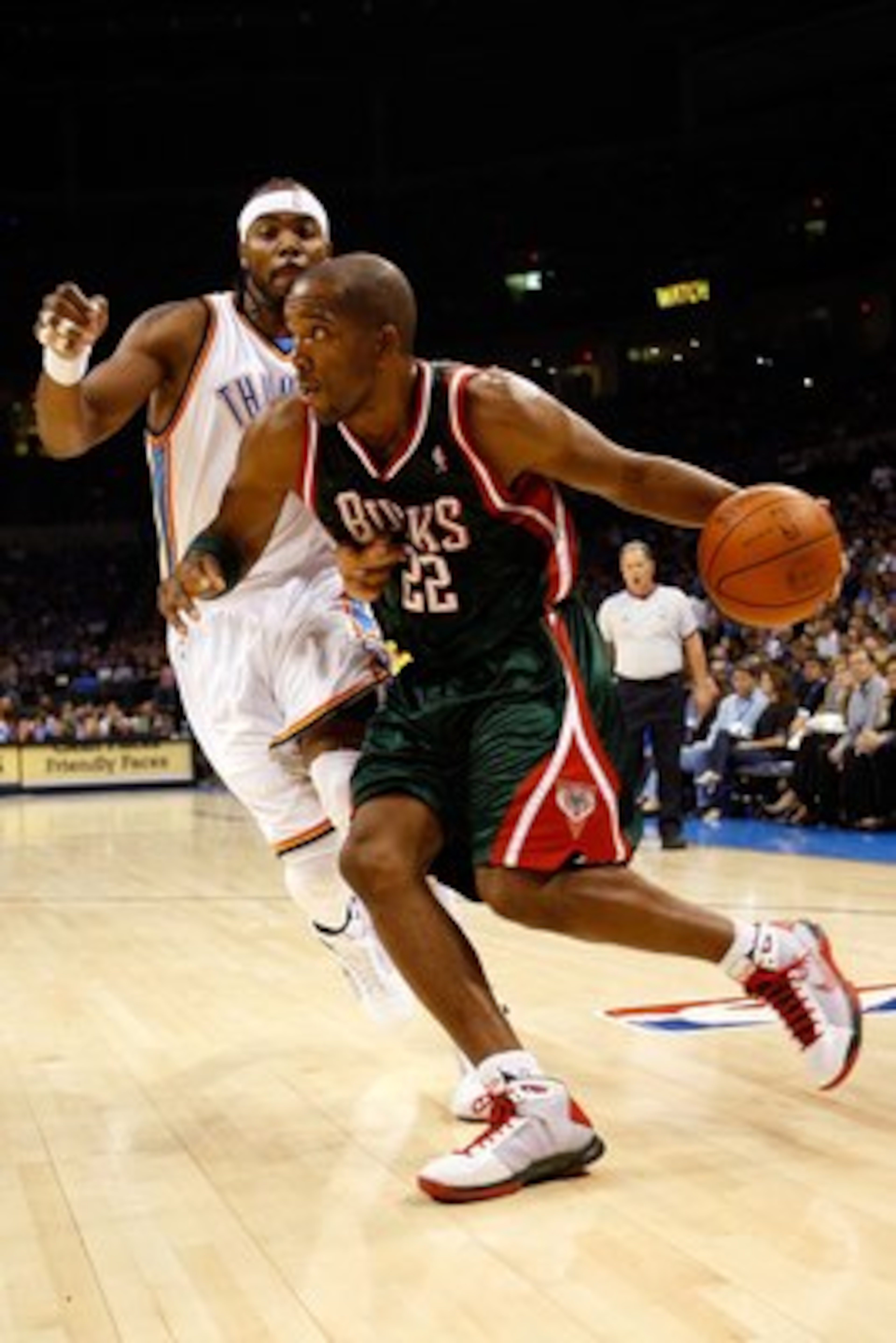 OKLAHOMA CITY - OCTOBER 29: Michael Redd #22 of the Milwaukee Bucks drives to the basket past Chris Wilcox #54 of the Oklahoma City Thunder at the Ford Center on October 29, 2008 in Oklahoma City, Oklahoma. The Bucks won 98-87. NOTE TO USER: User expres OKLAHOMA CITY - OCTOBER 29: Michael Redd #22 of the Milwaukee Bucks drives to the basket past Chris Wilcox #54 of the Oklahoma City Thunder at the Ford Center on October 29, 2008 in Oklahoma City, Oklahoma. The Bucks won 98-87. NOTE TO USER: User expres