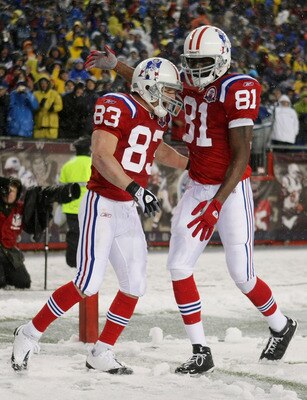 FOXBORO, MA - OCTOBER 18:  Wes Welker #83 of the New England Patriots is congratulated by teammate Randy Moss #81 after Welker scored a touchdown in the second quarter against the Tennessee Titans on October 18, 2009 at Gillette Stadium in Foxboro, Massac