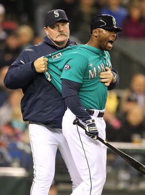 SEATTLE - FILE:  Milton Bradley #15 of the Seattle Mariners is restrained by manager Eric Wedge #22 after being ejected from the game against the Chicago White Sox at Safeco Field on May 6, 2011 in Seattle, Washington. According to reports May 9, 201, Bra