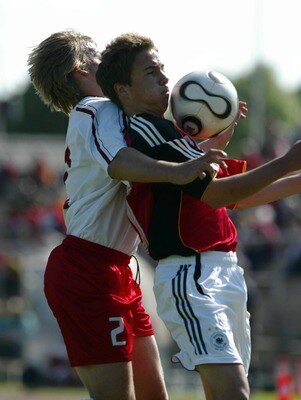 WEIMAR, GERMANY - MAY 18:  Filip Modelski (L) of Poland and Mario Goetze (R) of Germany battle for the ball during the Men's U15 friendly match between Germany and Poland at the Wimaria stadium on May 18, 2007 in Weimar, Germany. (Photo by Dirk Brzoska/Bo