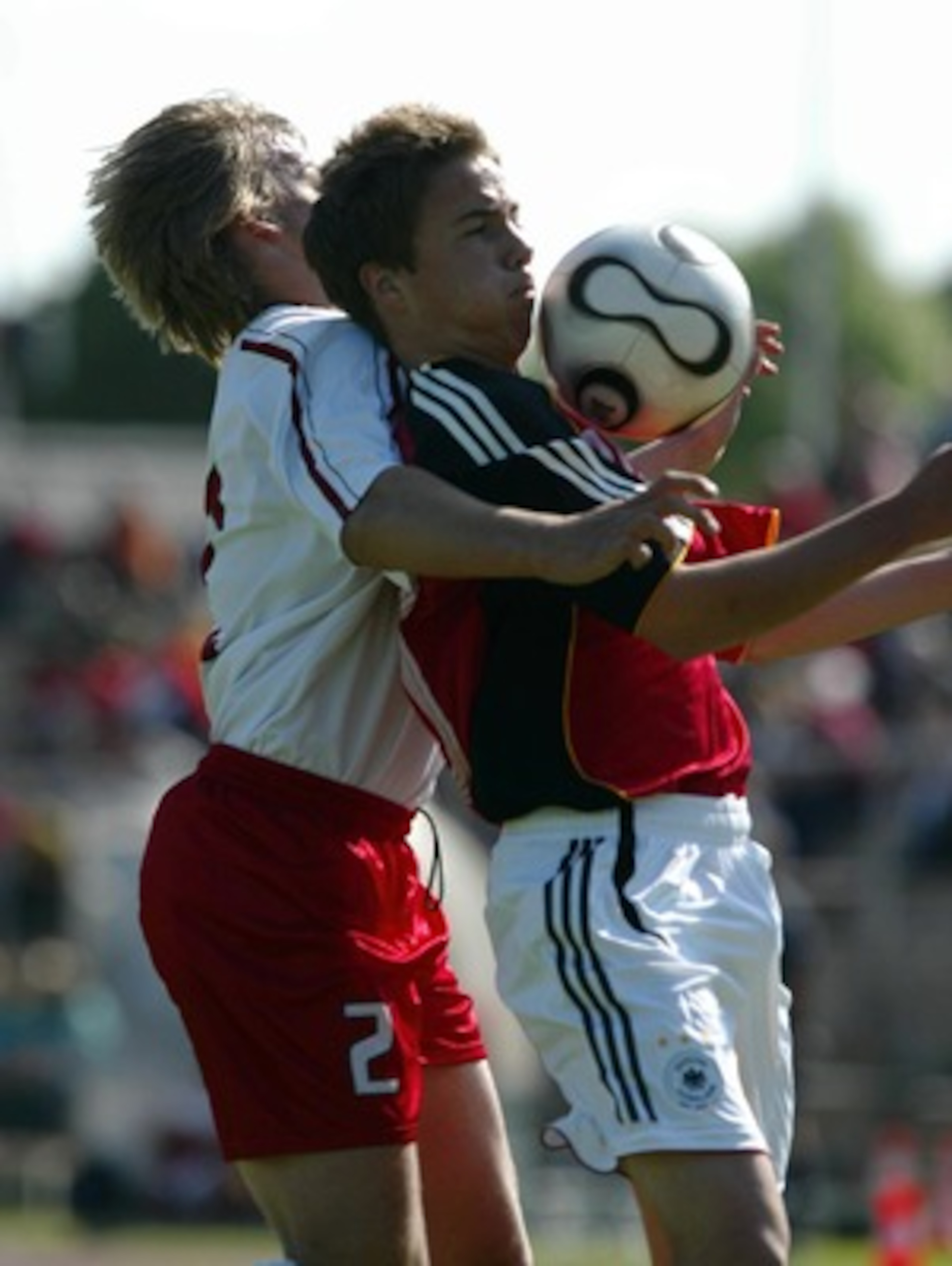 WEIMAR, GERMANY - MAY 18:  Filip Modelski (L) of Poland and Mario Goetze (R) of Germany battle for the ball during the Men's U15 friendly match between Germany and Poland at the Wimaria stadium on May 18, 2007 in Weimar, Germany. (Photo by Dirk Brzoska/Bo