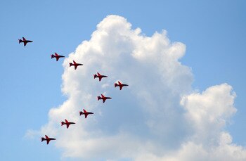 LONDON, ENGLAND - JUNE 11:  The Red Arrows perform a fly-past over the AEGON Championships at Queens Club after the Trooping the Colour parade on June 11, 2011 in London, England.  The ceremony of Trooping the Colour is believed to have first been perform