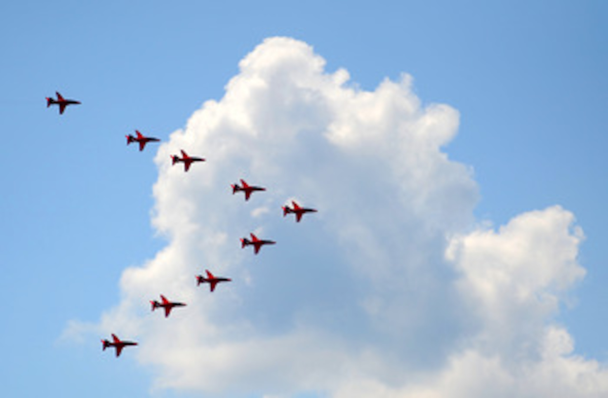 LONDON, ENGLAND - JUNE 11:  The Red Arrows perform a fly-past over the AEGON Championships at Queens Club after the Trooping the Colour parade on June 11, 2011 in London, England.  The ceremony of Trooping the Colour is believed to have first been perform