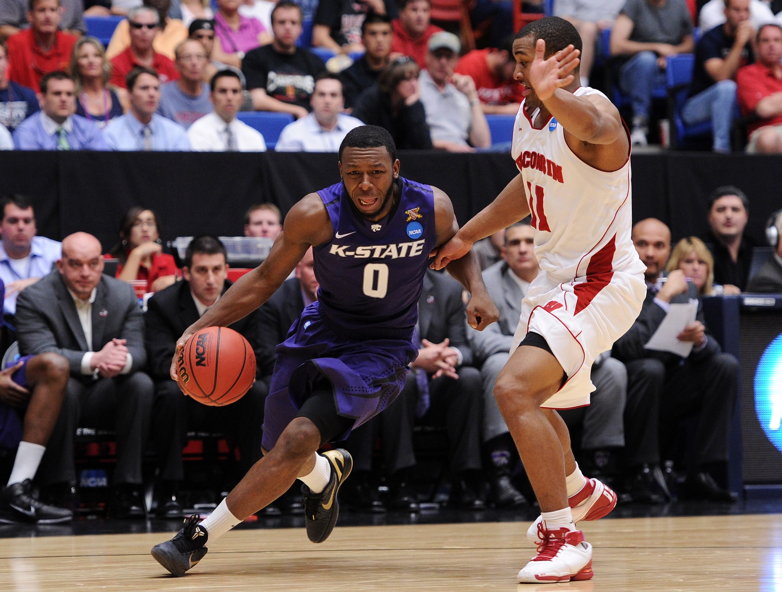 TUCSON, AZ - MARCH 19:  Jacob Pullen #0 of the Kansas State Wildcats drives against Jordan Taylor #11 of the Wisconsin Badgers during the third round of the 2011 NCAA men's basketball tournament at McKale Center on March 19, 2011 in Tucson, Arizona.  (Pho