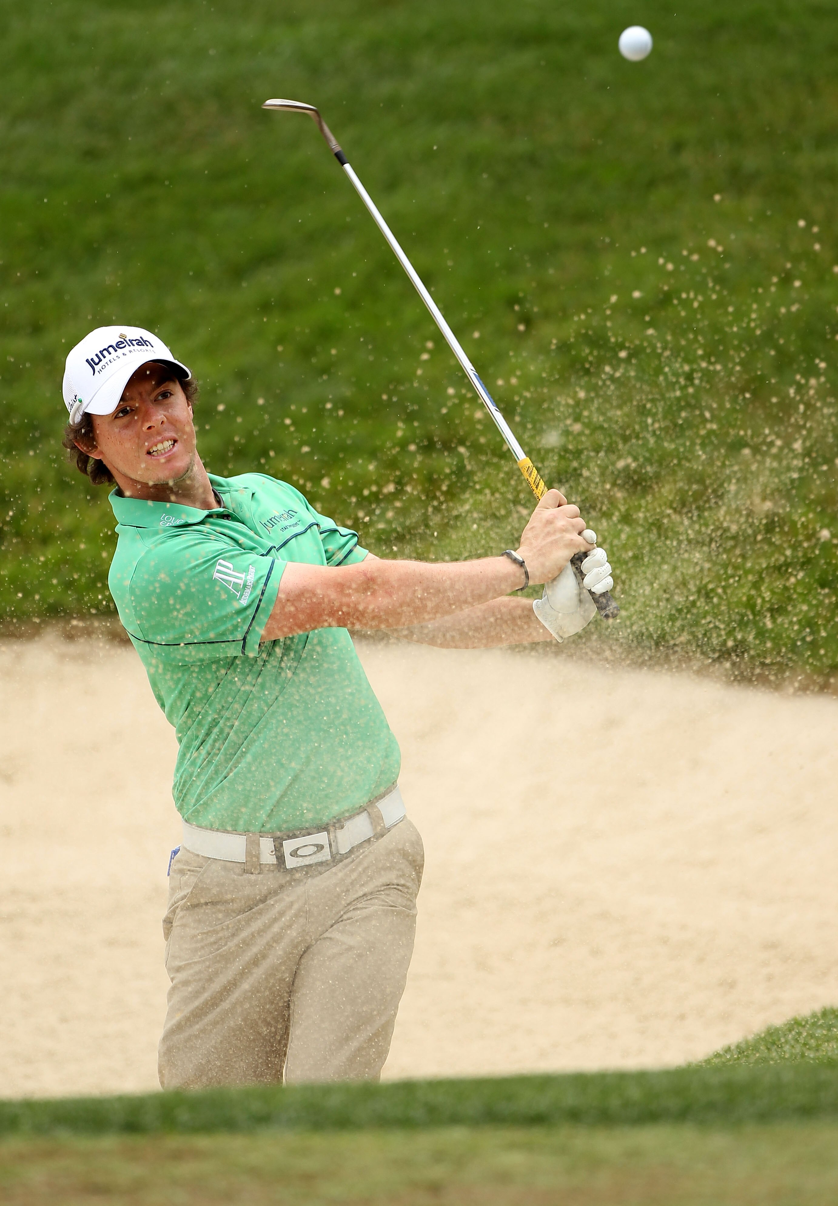 BETHESDA, MD - JUNE 14:  Rory McIlroy of Northern Ireland plays a bunker shot during a practice round prior to the start of the 111th U.S. Open at Congressional Country Club on June 14, 2011 in Bethesda, Maryland.  (Photo by Andrew Redington/Getty Images)