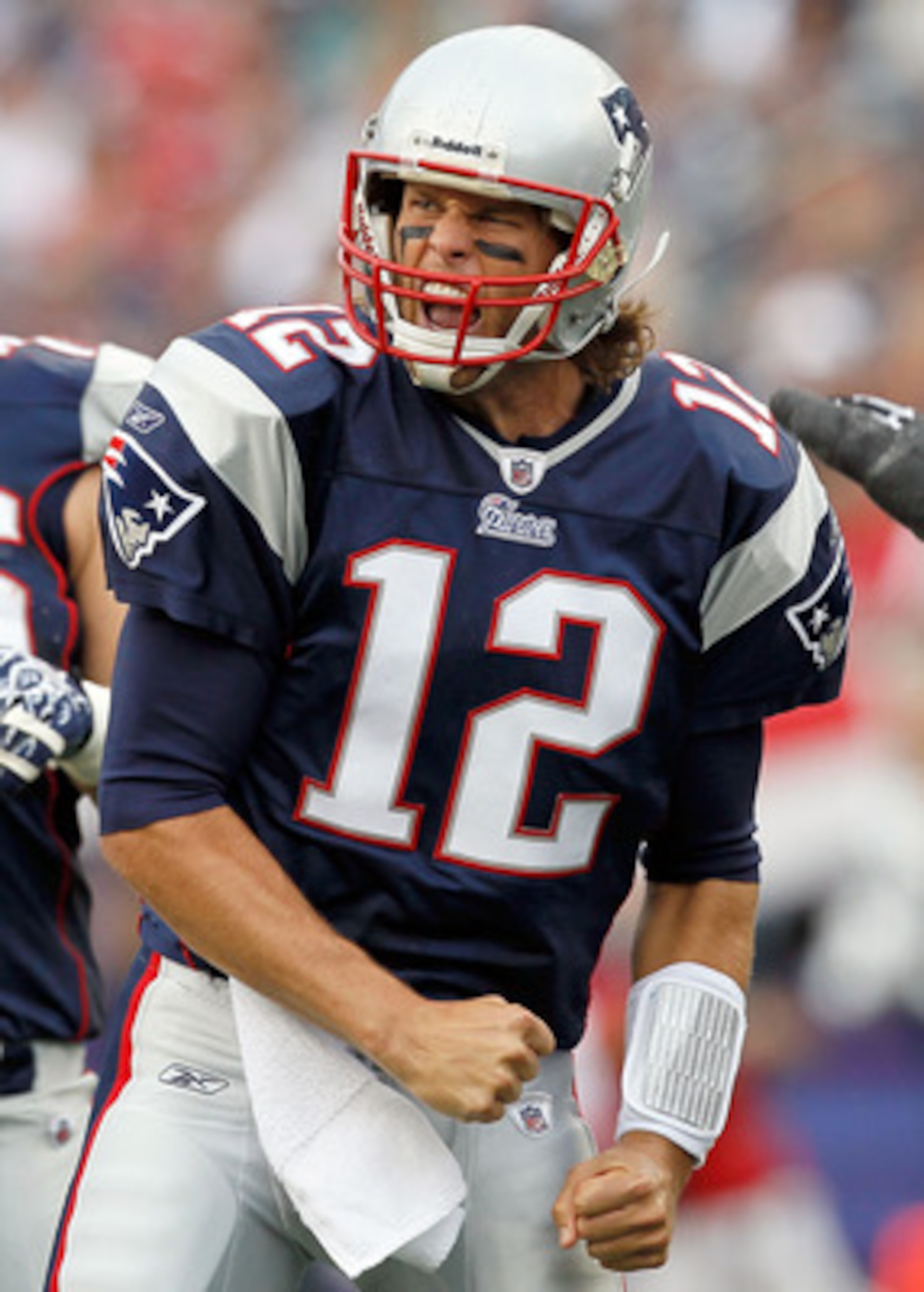 FOXBORO, MA - SEPTEMBER 26:  Tom Brady #12 of the New England Patriots reacts after running the ball for a first down against the Buffalo Bills in the second half at Gillette Stadium on September 26, 2010 in Foxboro, Massachusetts. (Photo by Jim Rogash/Ge