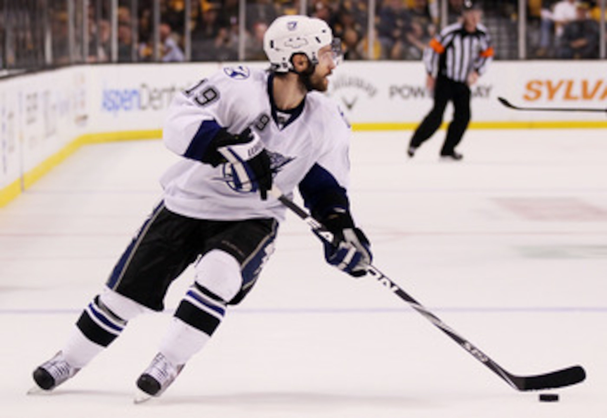 BOSTON, MA - MAY 23:  Dominic Moore #19 of the Tampa Bay Lightning controls the puck in Game Five of the Eastern Conference Finals against the Boston Bruins during the 2011 NHL Stanley Cup Playoffs at TD Garden on May 23, 2011 in Boston, Massachusetts.  (