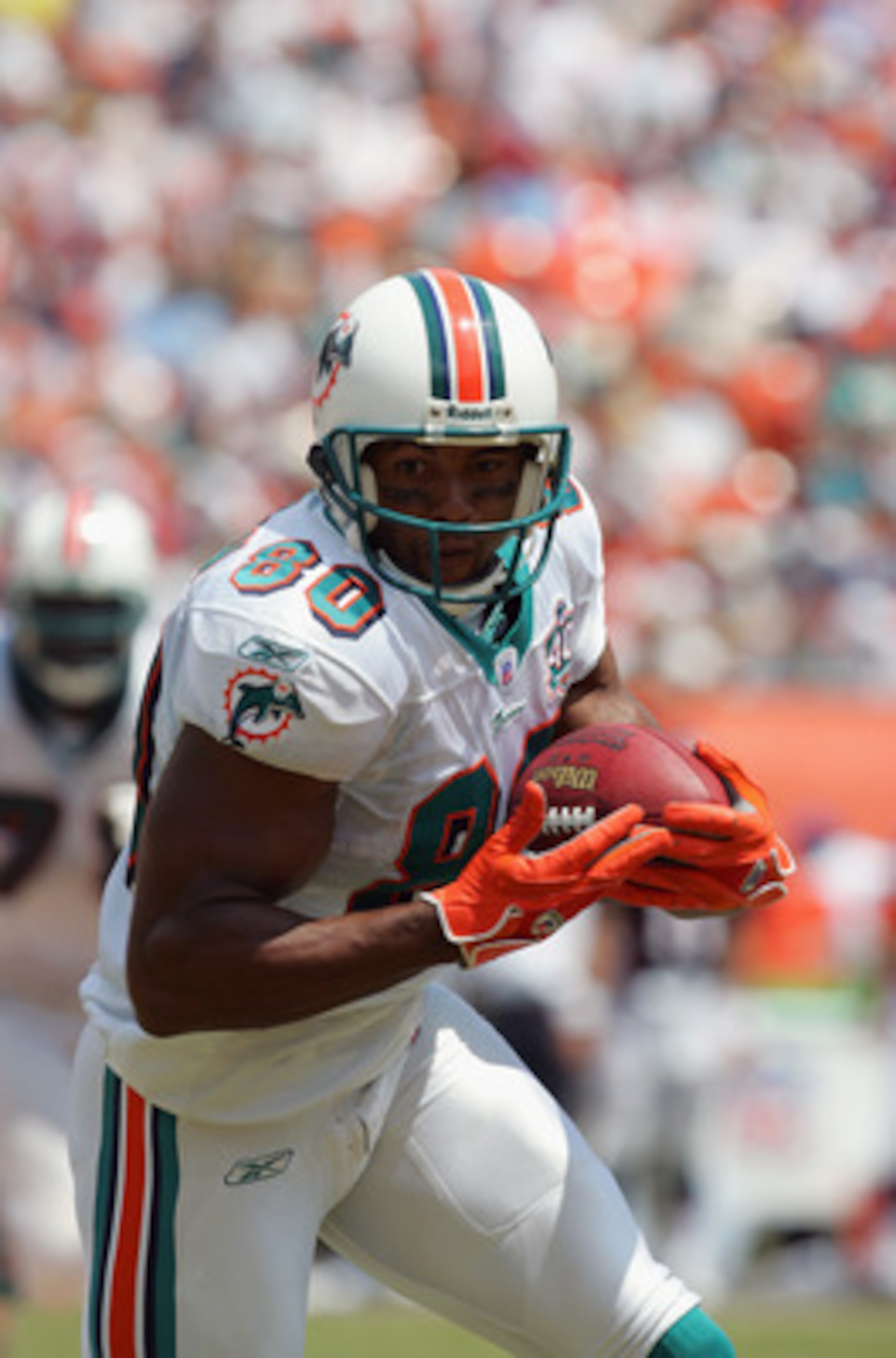 MIAMI - SEPTEMBER 11:  David Boston #80 of the Miami Dolphins heads upfield against the Denver Broncos at Dolphins Stadium on September 11, 2005 in Miami, Florida. The Dolphins defeated the Broncos 34-10.  (Photo by Ronald Martinez/Getty Images)