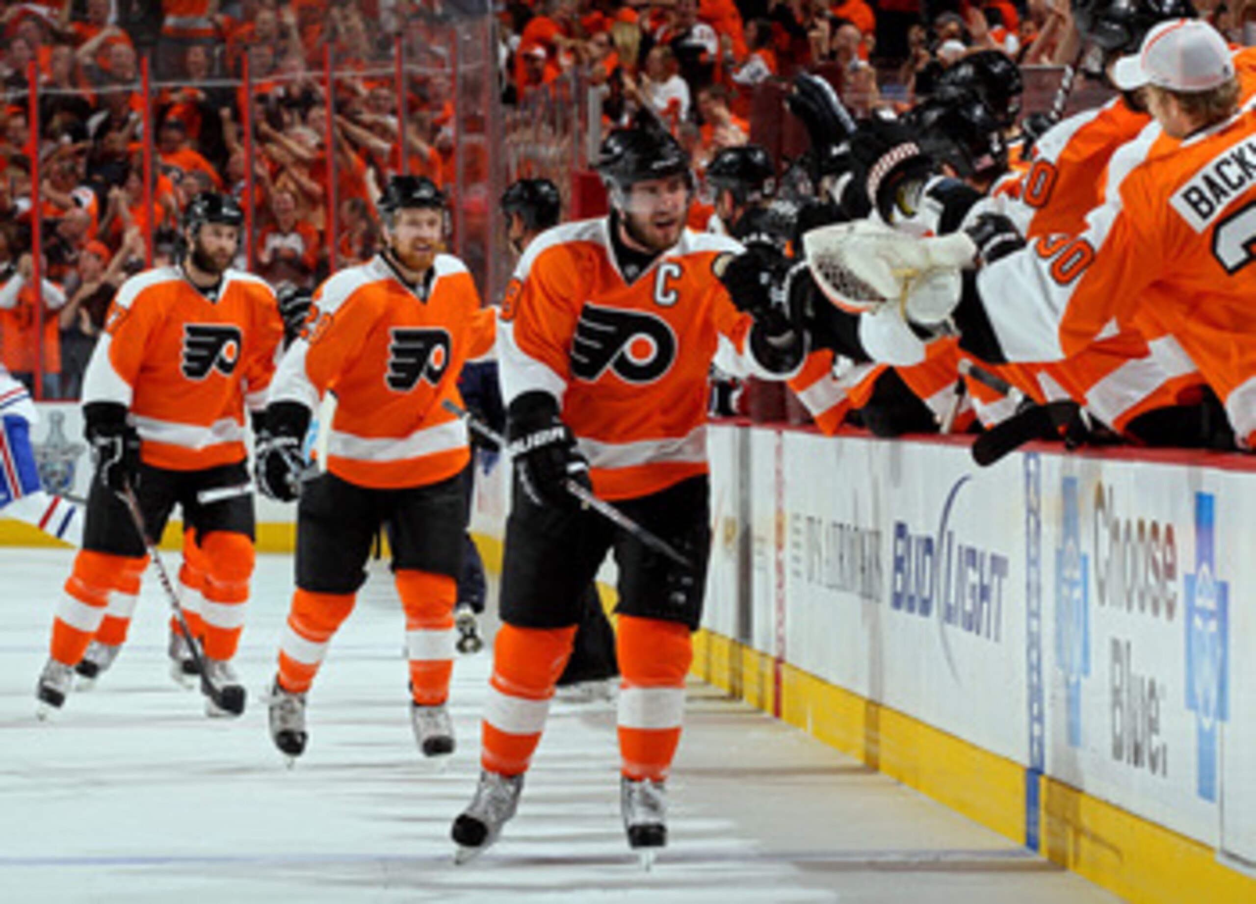 PHILADELPHIA - MAY 24:  Mike Richards #18 of the Philadelphia Flyers celebrates with his team after scoring a goal in the first period against Jaroslav Halak #41 of the Montreal Canadiens in Game 5 of the Eastern Conference Finals during the 2010 NHL Stan