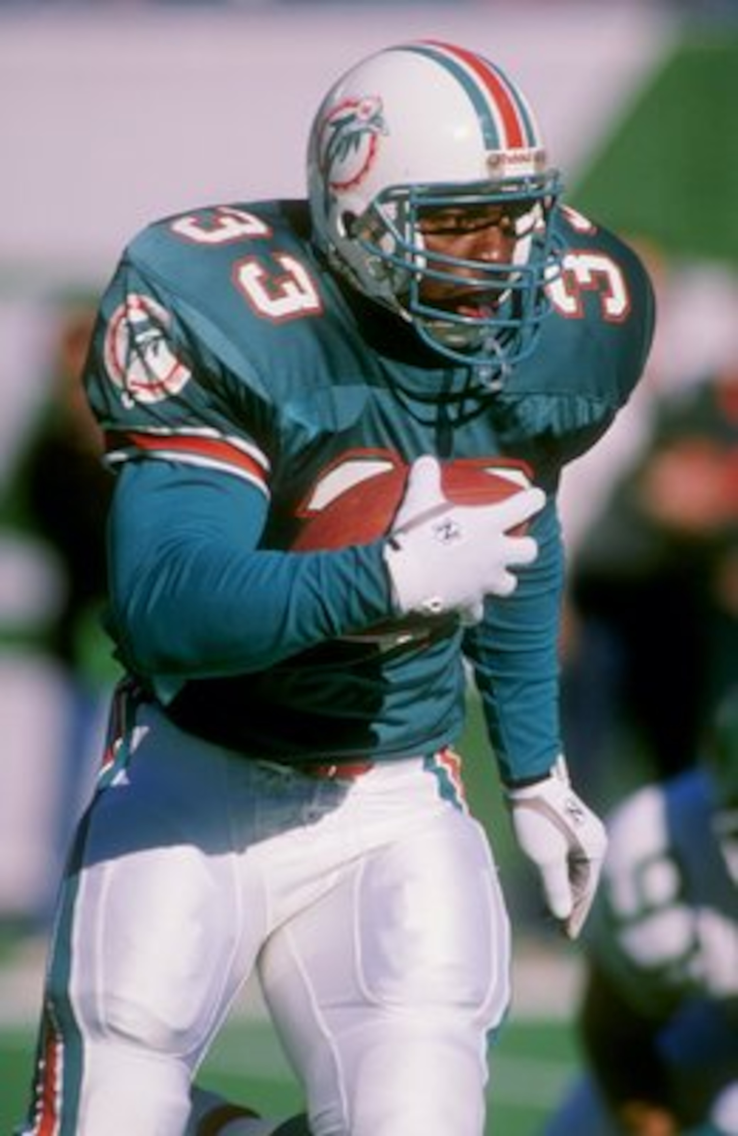 1989-1990:  Running back Sammie Smith of the Miami Dolphins runs with the ball. Mandatory Credit: T. G. Higgins  /Allsport