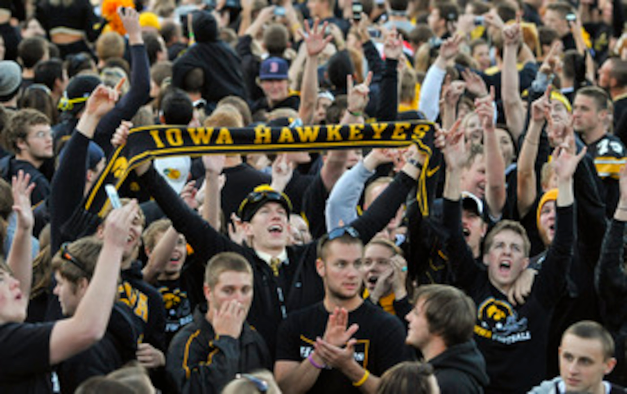 IOWA CITY, IA - OCTOBER 30: University of Iowa Hawkeyes fans celebrate their win over the Michigan State Spartans at Kinnick Stadium on October 30, 2010 in Iowa City, Iowa. Iowa won 37-6 over Michigan State. (Photo by David Purdy/Getty Images)