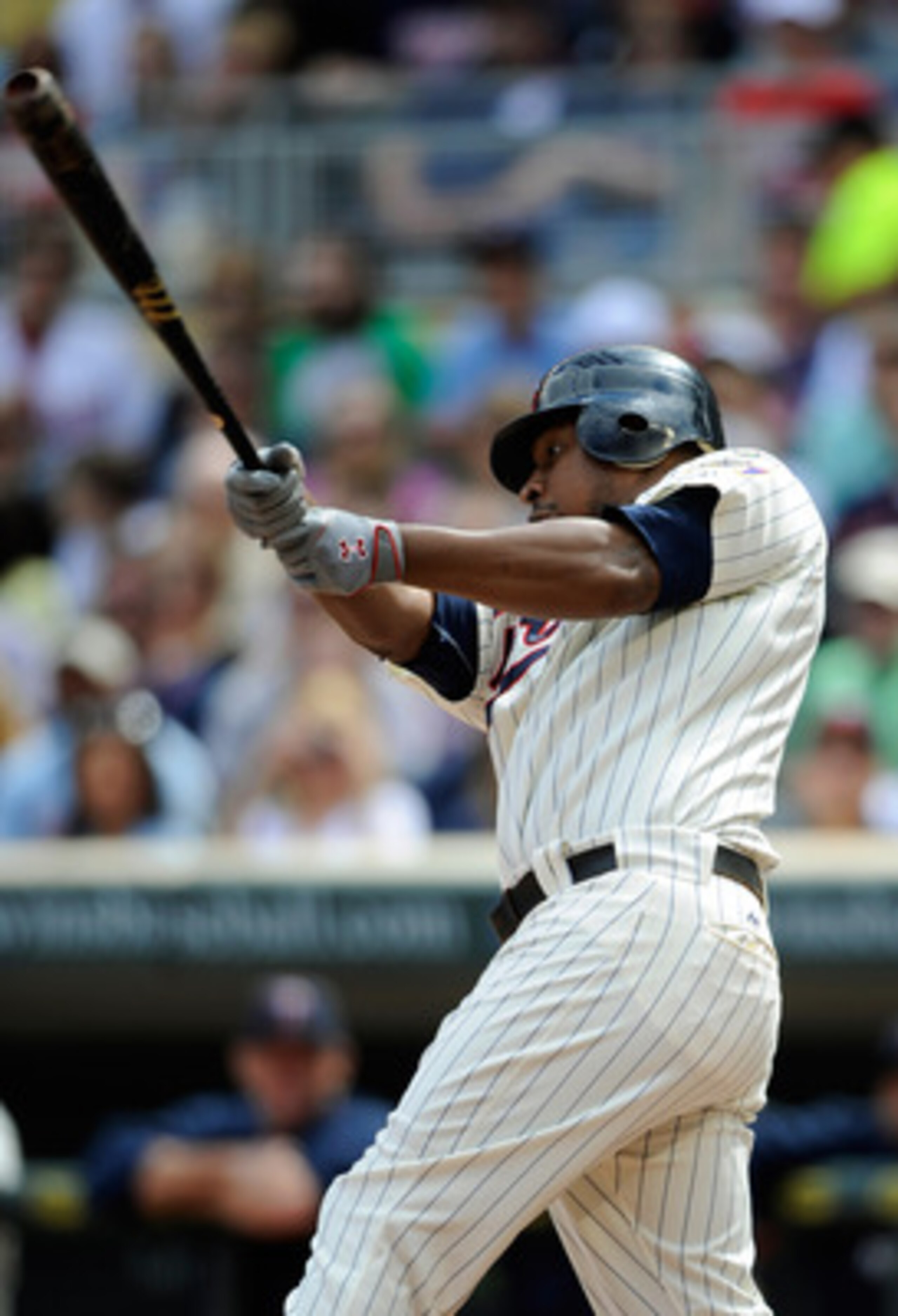 MINNEAPOLIS, MN - JUNE 11: Delmon Young #21 of the Minnesota Twins singles against the Texas Rangers during the first inning of their game on June 11, 2011 at Target Field in Minneapolis, Minnesota. The Twins defeated the Rangers 8-1. (Photo by Hannah Fos MINNEAPOLIS, MN - JUNE 11: Delmon Young #21 of the Minnesota Twins singles against the Texas Rangers during the first inning of their game on June 11, 2011 at Target Field in Minneapolis, Minnesota. The Twins defeated the Rangers 8-1. (Photo by Hannah Fos