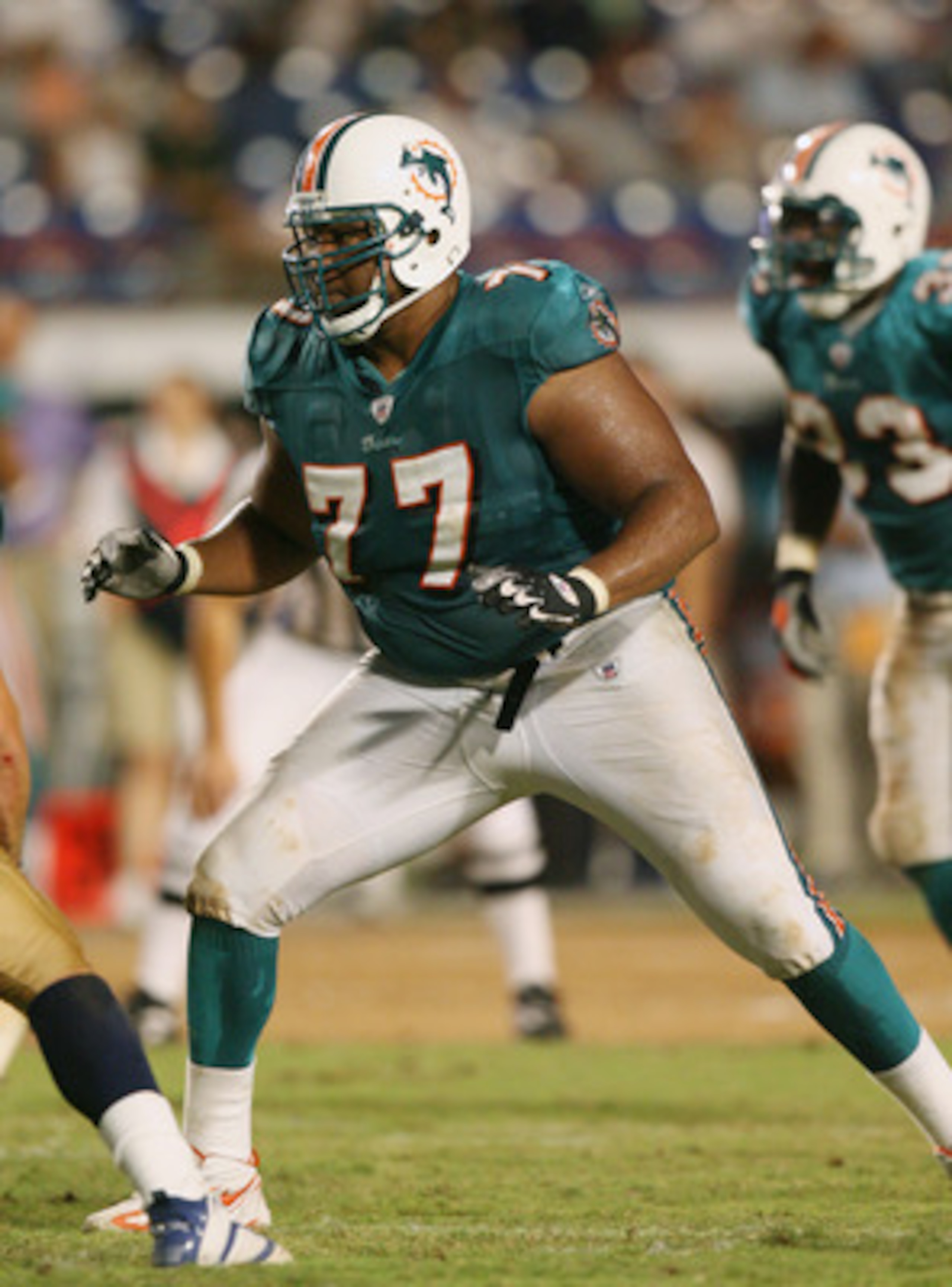 MIAMI - AUGUST 31:  Tackle Damion McIntosh #77 of the Miami Dolphins blocks against the St. Louis Rams during the NFL game at Dolphin Stadium on August 31, 2006 in Miami, Florida. The Dolphins defeated the Rams 29-9. (Photo by Doug Benc/Getty Images)