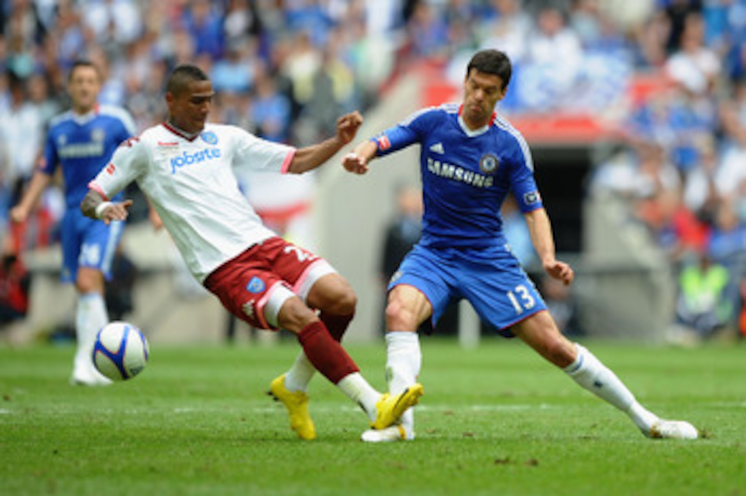 LONDON, ENGLAND - MAY 15:  Michael Ballack of Chelsea is tackled and fouled by Kevin Prince Boateng of Portsmouth during the FA Cup sponsored by E.ON Final match between Chelsea and Portsmouth at Wembley Stadium on May 15, 2010 in London, England.  (Photo