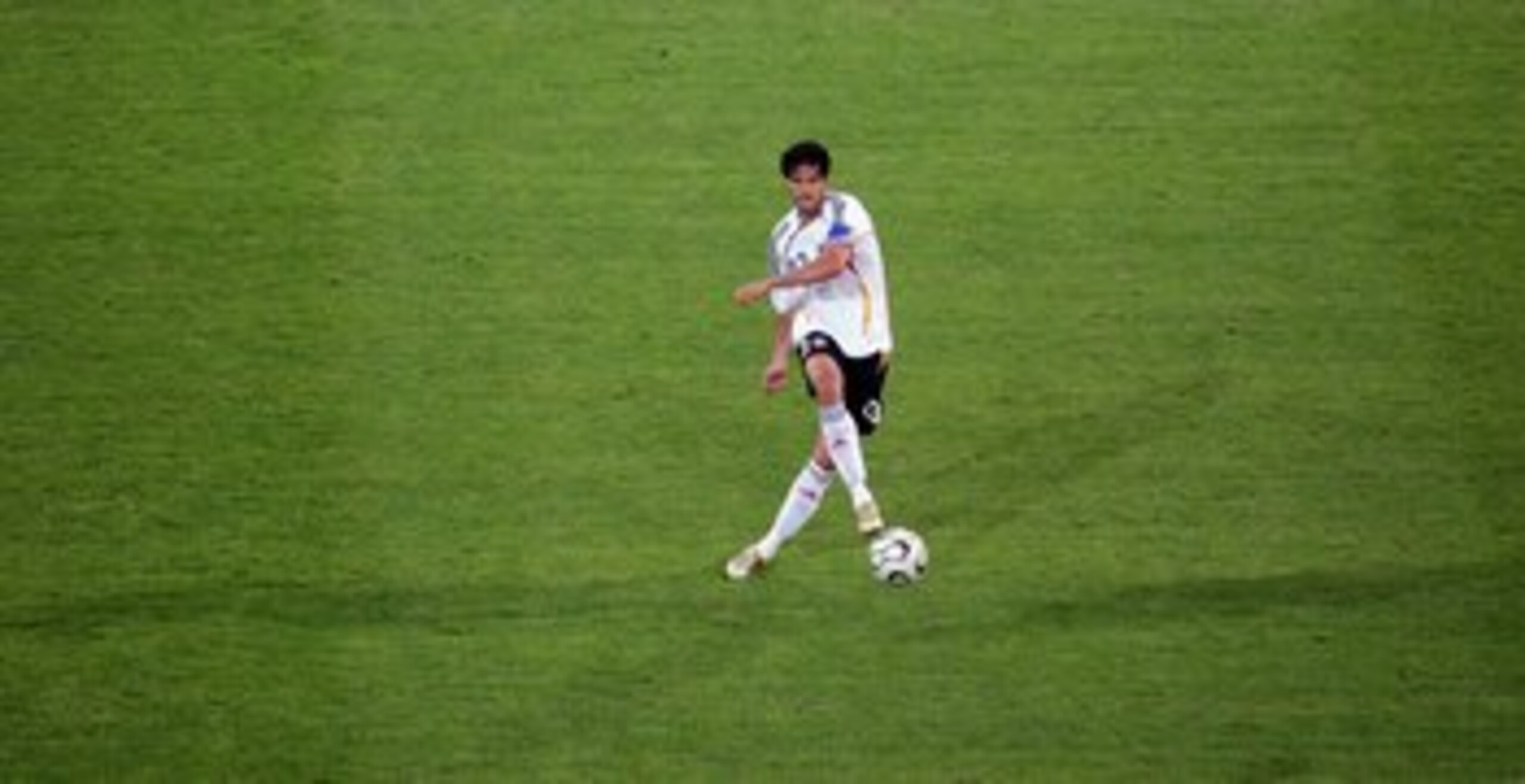 DORTMUND, GERMANY - JUNE 14:  Michael Ballack of Germany makes a pass during the FIFA World Cup Germany 2006 Group A match between Germany and Poland at the Stadium Dortmund on June 14, 2006 in Dortmund, Germany.  (Photo by Laurence Griffiths/Getty Images
