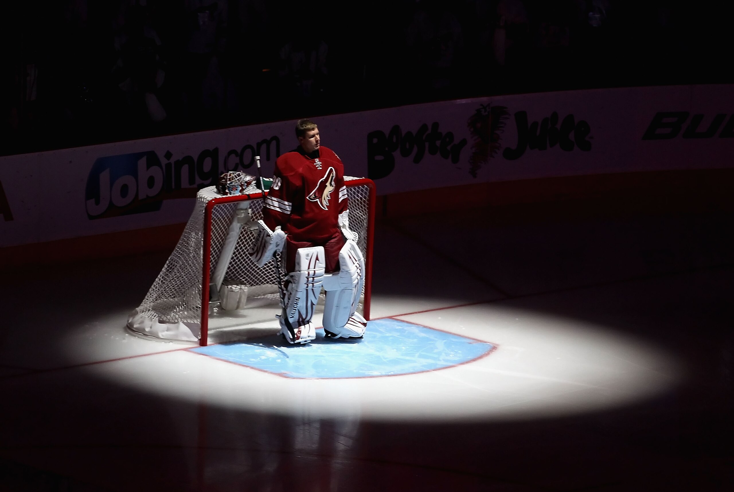 GLENDALE, AZ - APRIL 20:  Goaltender Ilya Bryzgalov #30 of the Phoenix Coyotes stands attended for the National Anthem before Game Four of the Western Conference Quarterfinals against the Detroit Red Wings during the 2011 NHL Stanley Cup Playoffs at Jobin