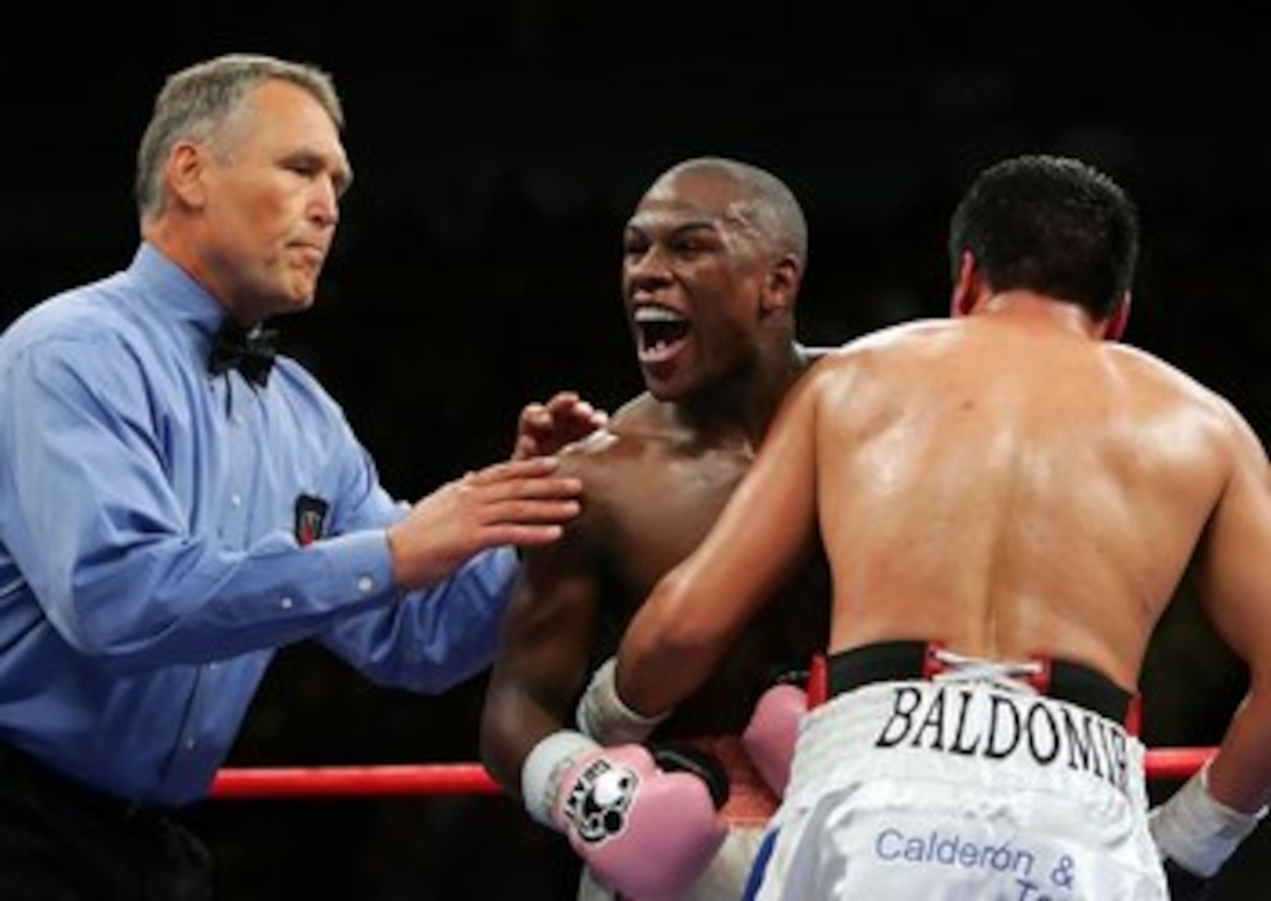 LAS VEGAS - NOVEMBER 04:  Floyd Mayweather (C) yells as referee Jay Nady comes over to seperate Carlos Baldomir of Argentina off of Mayweather during their WBC Welterweight Championship fight at the Mandalay Bay Events Center November 4, 2006 in Las Vegas