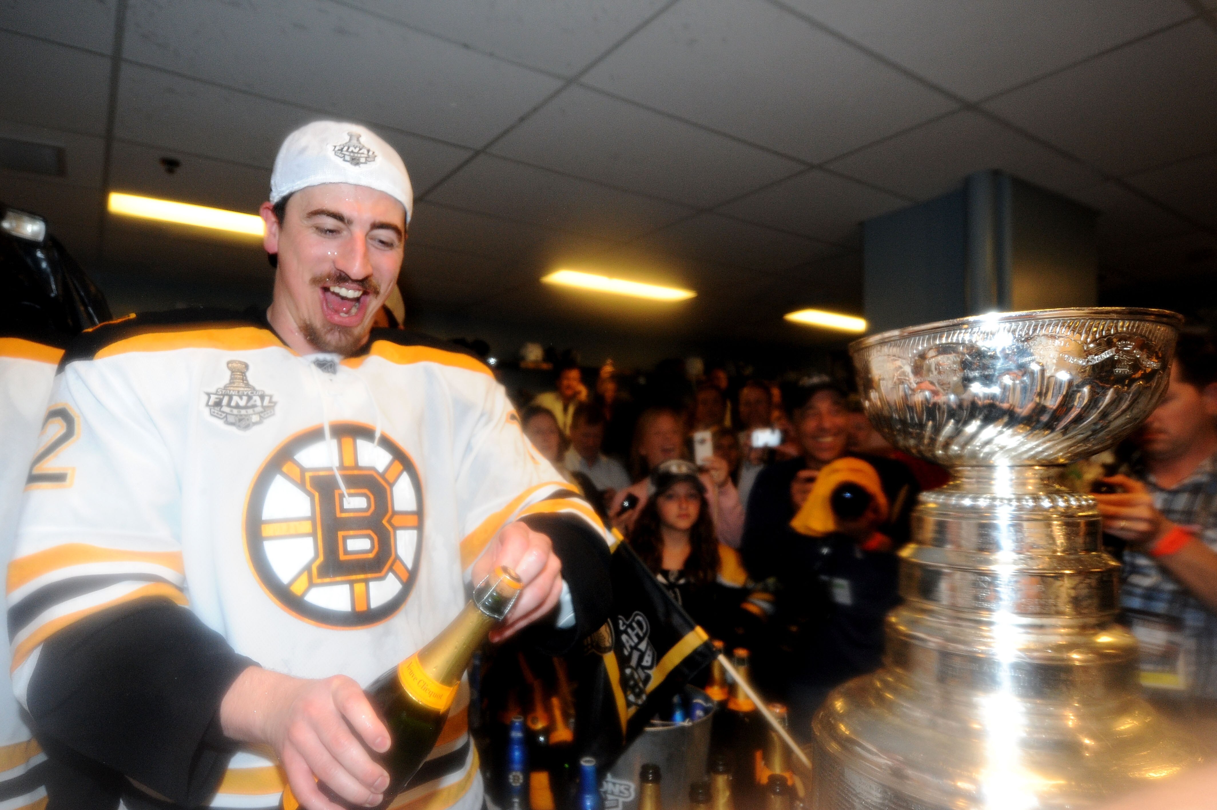 VANCOUVER, BC - JUNE 15:  Tomas Kaberle #12 of the Boston Bruins celebrates in the locker room after defeating the Vancouver Canucks in Game Seven of the 2011 NHL Stanley Cup Final at Rogers Arena on June 15, 2011 in Vancouver, British Columbia, Canada. T