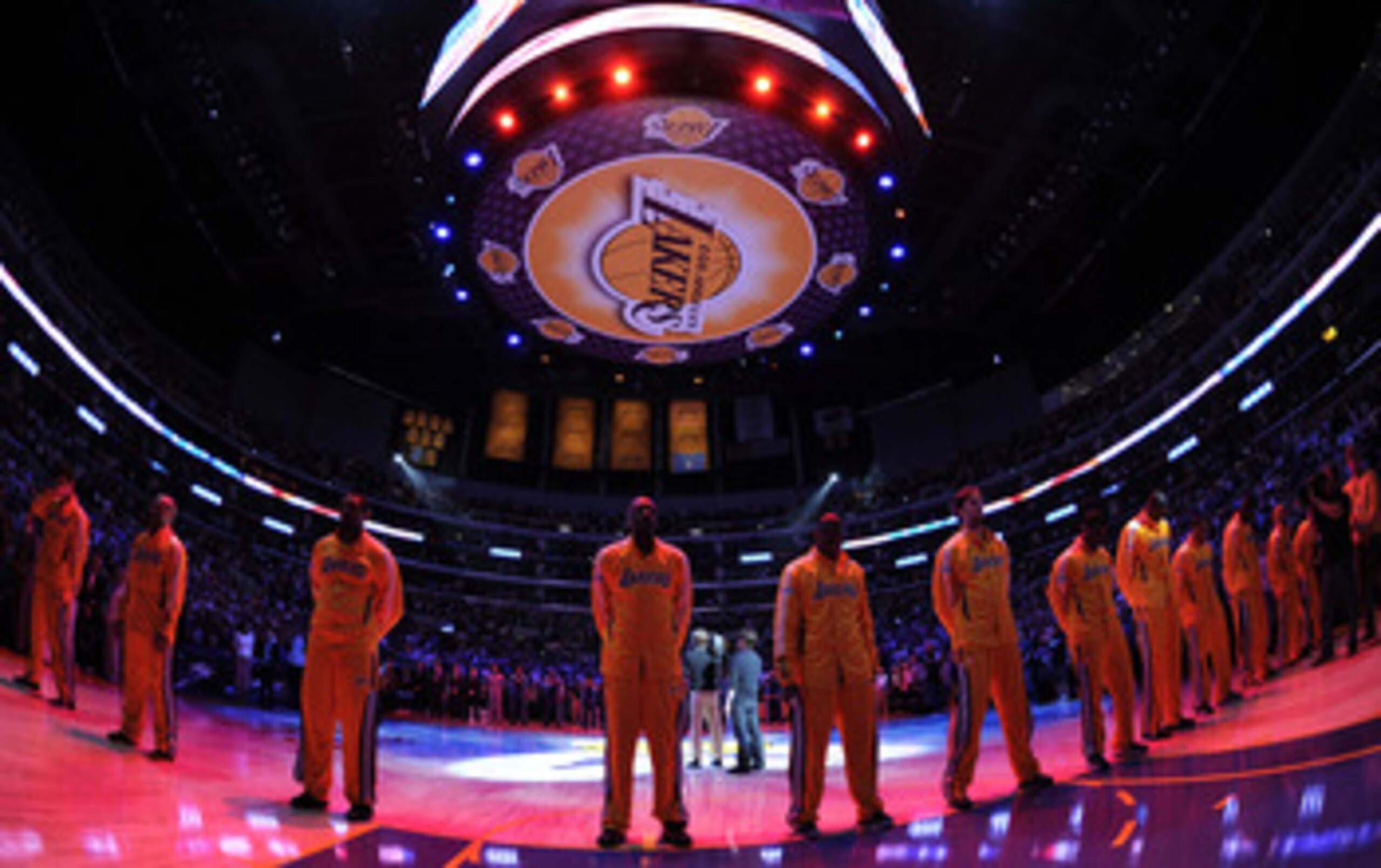 LOS ANGELES, CA - APRIL 26:  The Los Angeles Lakers stand during the national anthem before taking on the New Orleans Hornets in Game Five of the Western Conference Quarterfinals in the 2011 NBA Playoffs on April 26, 2011 at Staples Center in Los Angeles,