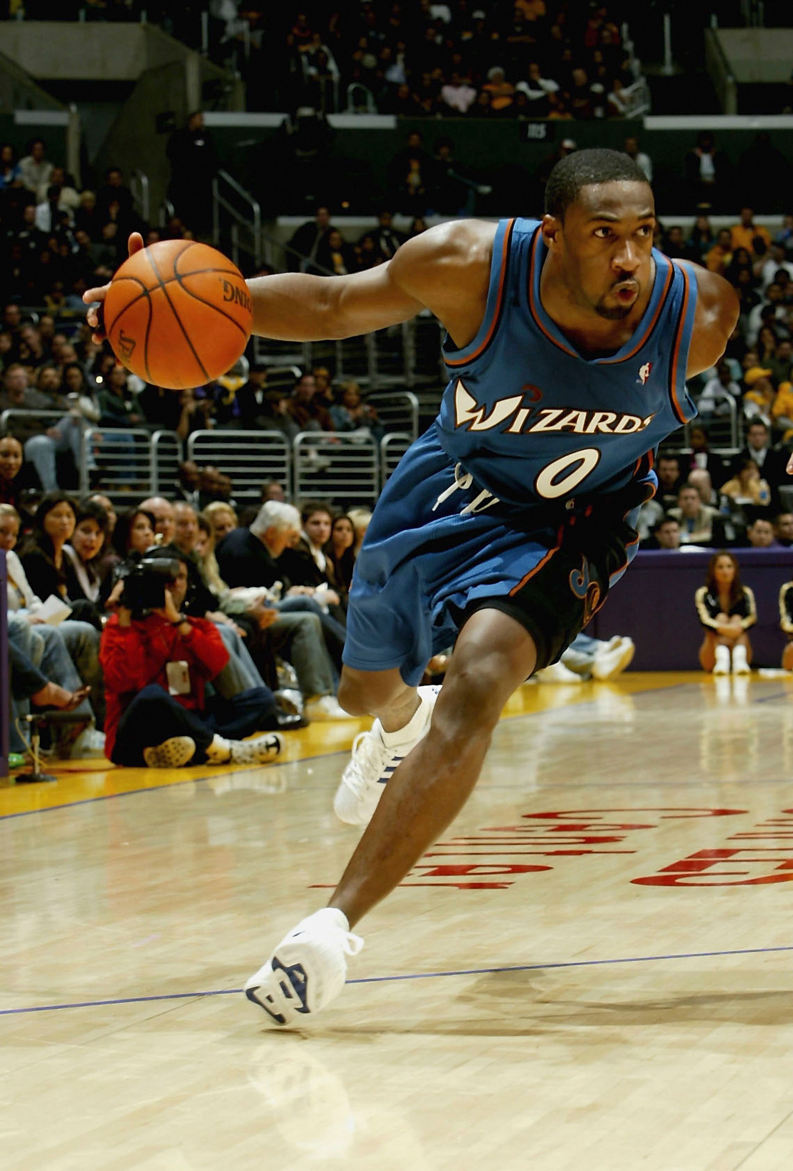LOS ANGELES - DECEMBER 16:  Gilbert Arenas #0 of the Washington Wizards drives against the Los Angeles Lakers on December 16, 2005 at Staples Center in Los Angeles, California.  The Lakers won 97-91. NOTE TO USER: User expressly acknowledges and agrees th