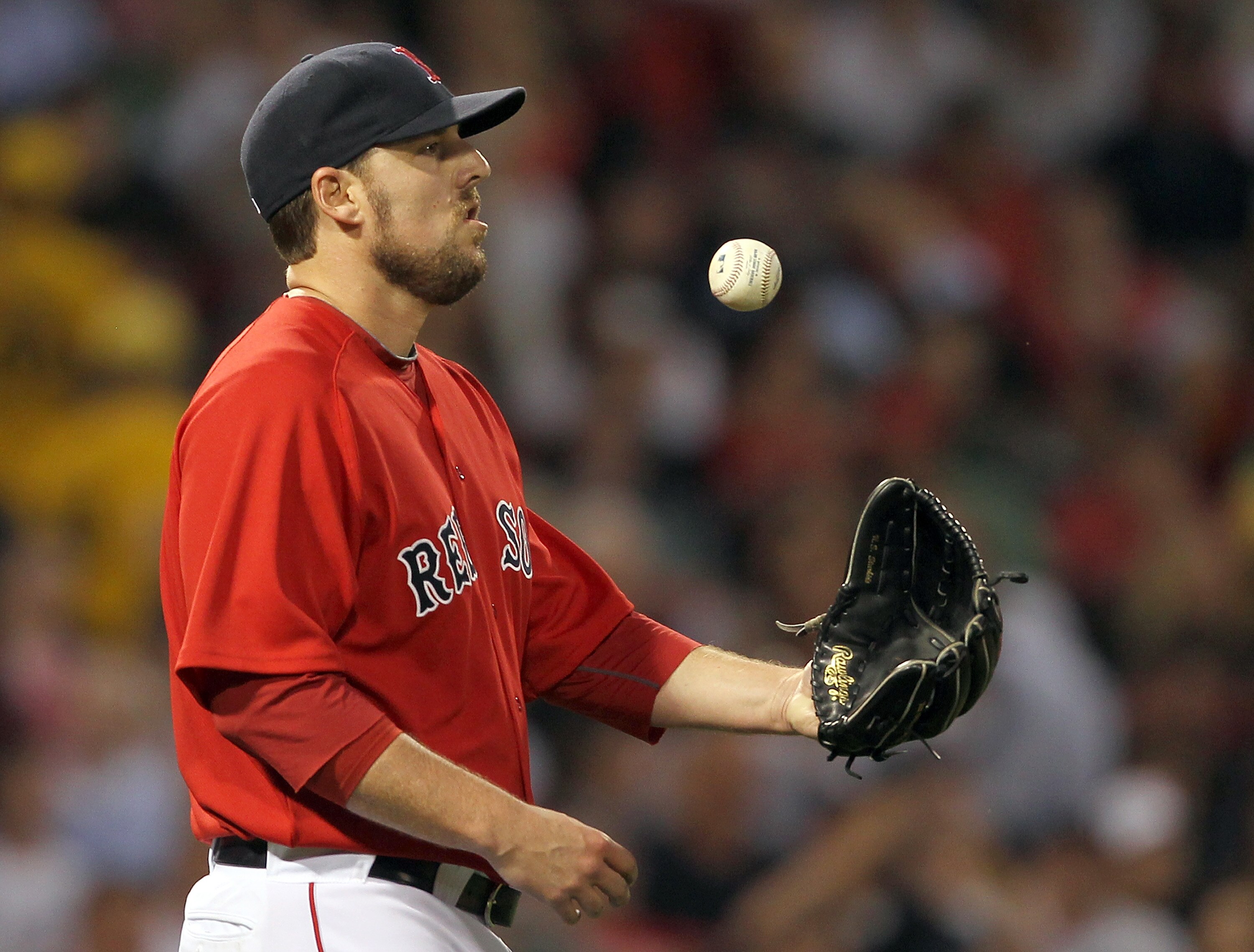 BOSTON, MA - JUNE 17: John Lackey #41 of the Boston Red Sox reacts in the third inning against the Milwaukee Brewers at Fenway Park on June 17, 2011 in Boston, Massachusetts. (Photo by Jim Rogash/Getty Images) BOSTON, MA - JUNE 17: John Lackey #41 of the Boston Red Sox reacts in the third inning against the Milwaukee Brewers at Fenway Park on June 17, 2011 in Boston, Massachusetts. (Photo by Jim Rogash/Getty Images)